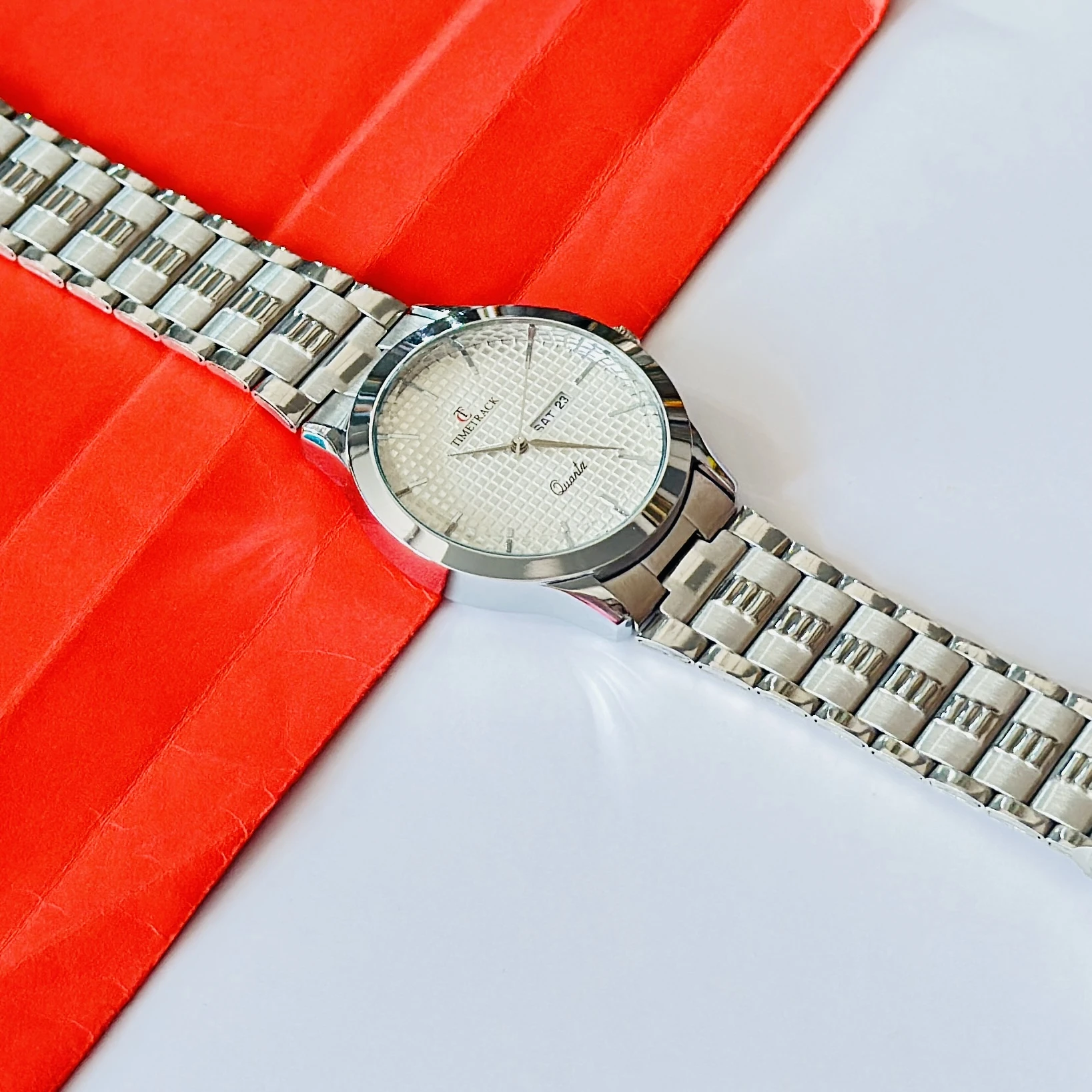 silver-toned stainless steel analogue watch