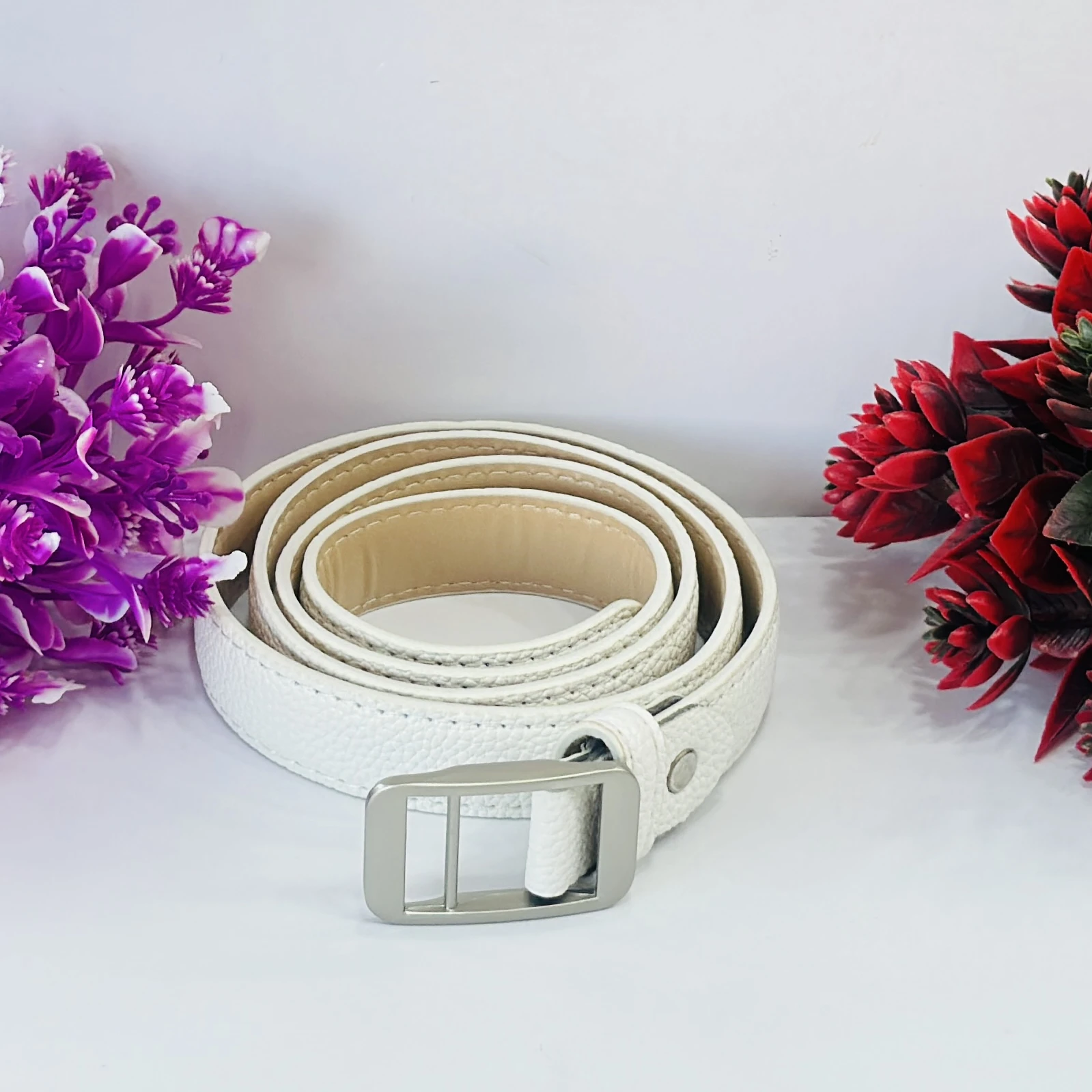 white artificial leather belt
