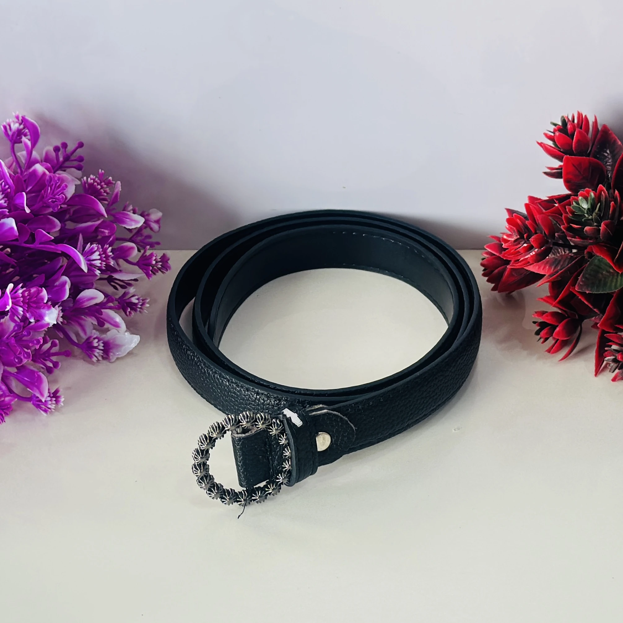 Black PU leather belt with an embellished metal buckle.