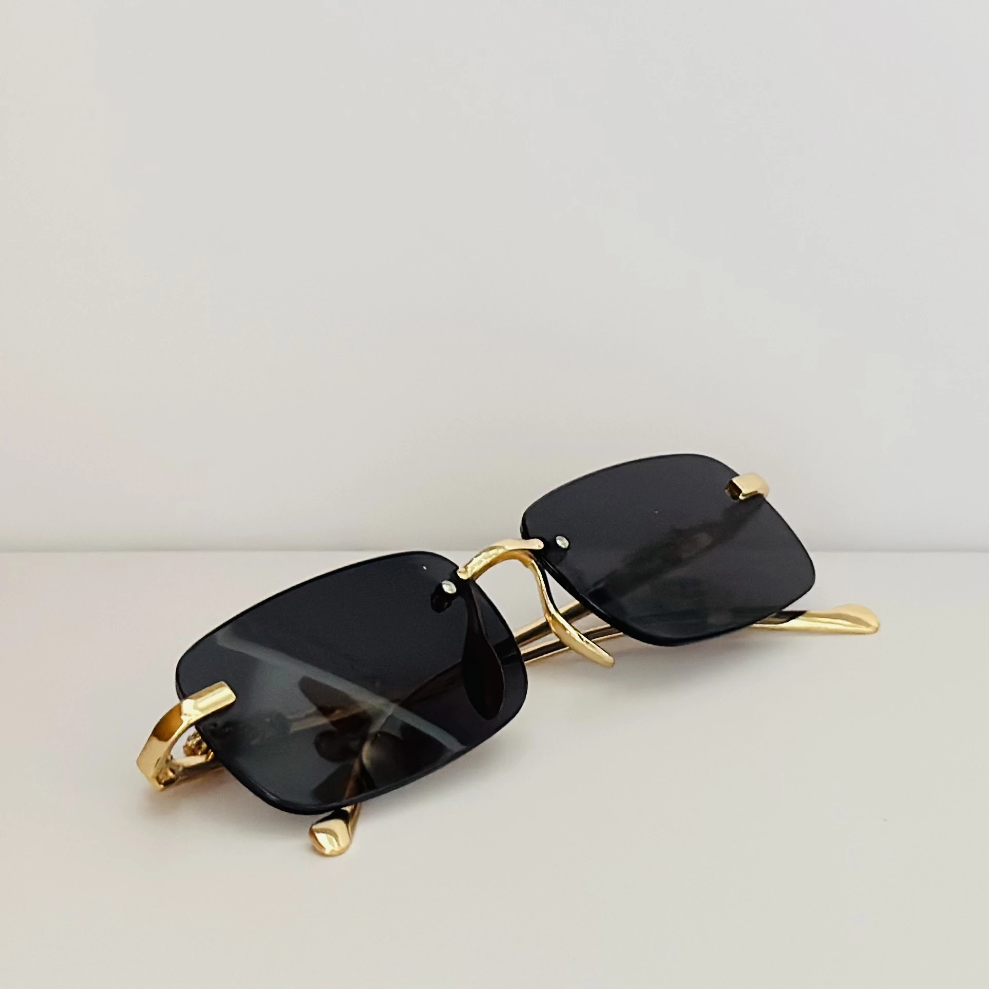 Gucci GG1221S 001 rimless rectangular sunglasses
