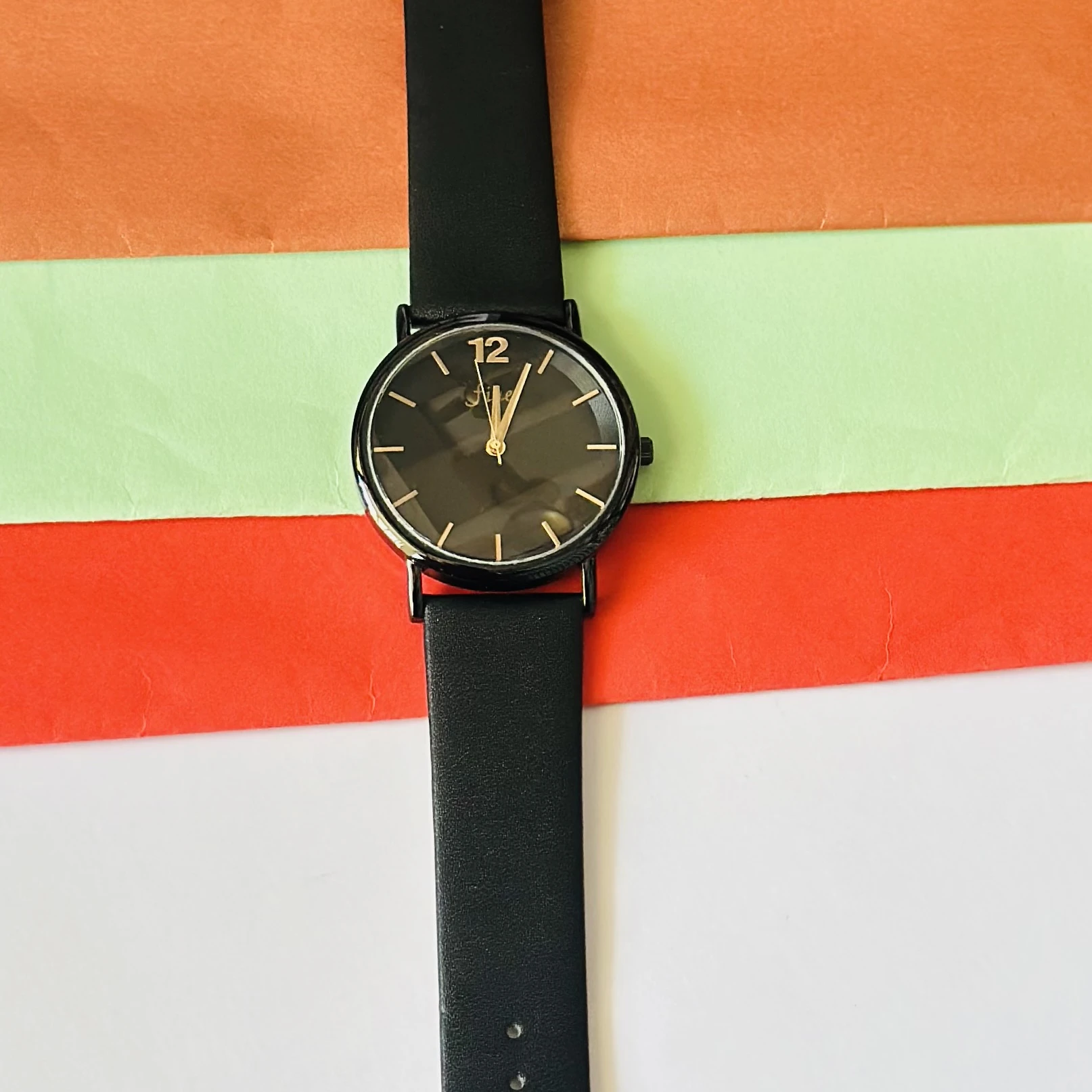 Witch Ines all-black faux leather strap watch for women.