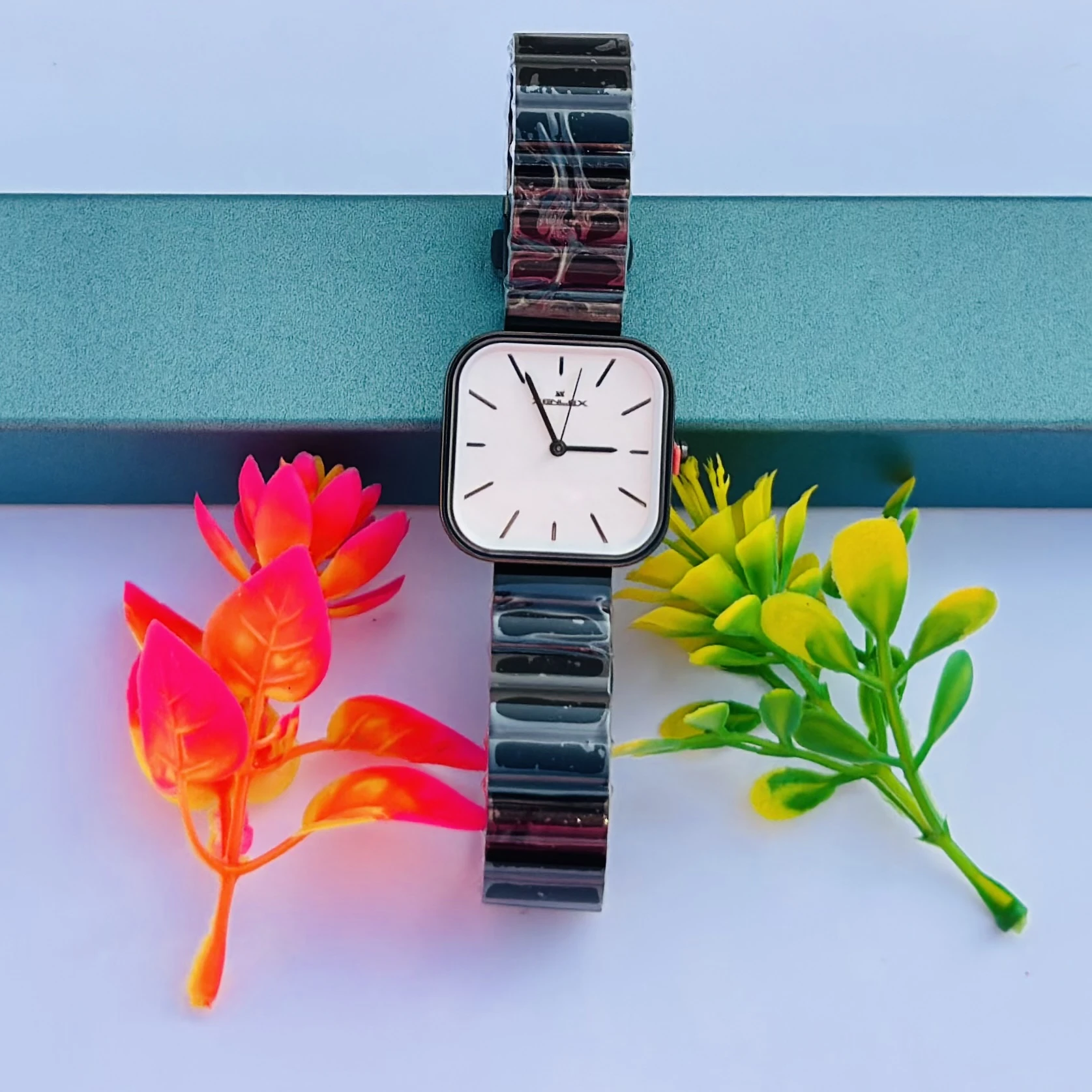 Analog watch with a black stainless steel bracelet.