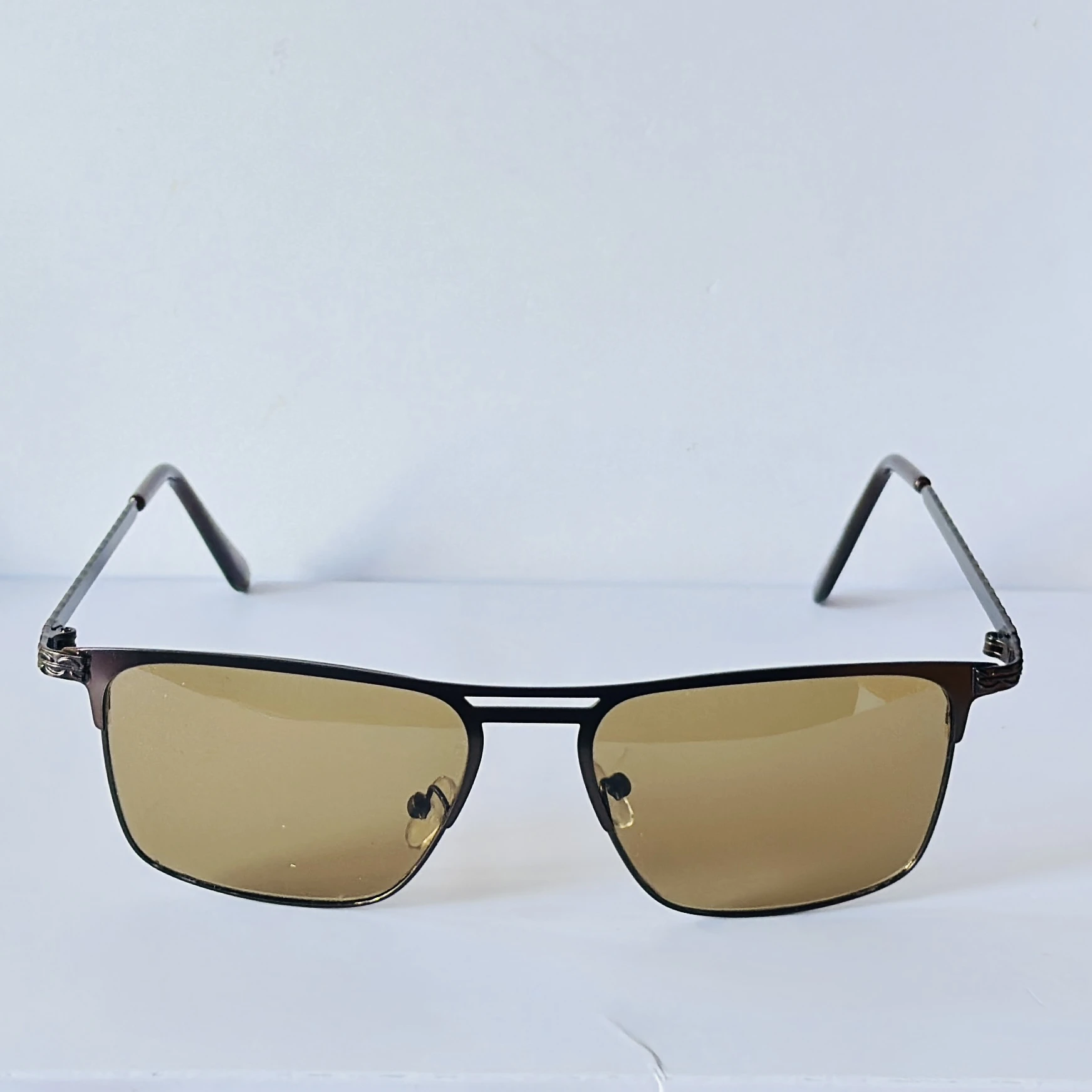 sunglasses appear to be the Vincent Chase