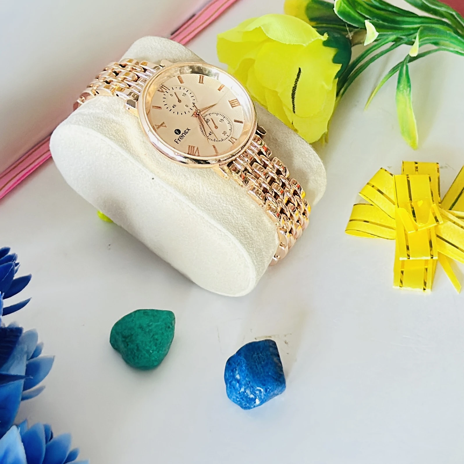 Frenex brand rose gold analog wristwatch with a metal strap