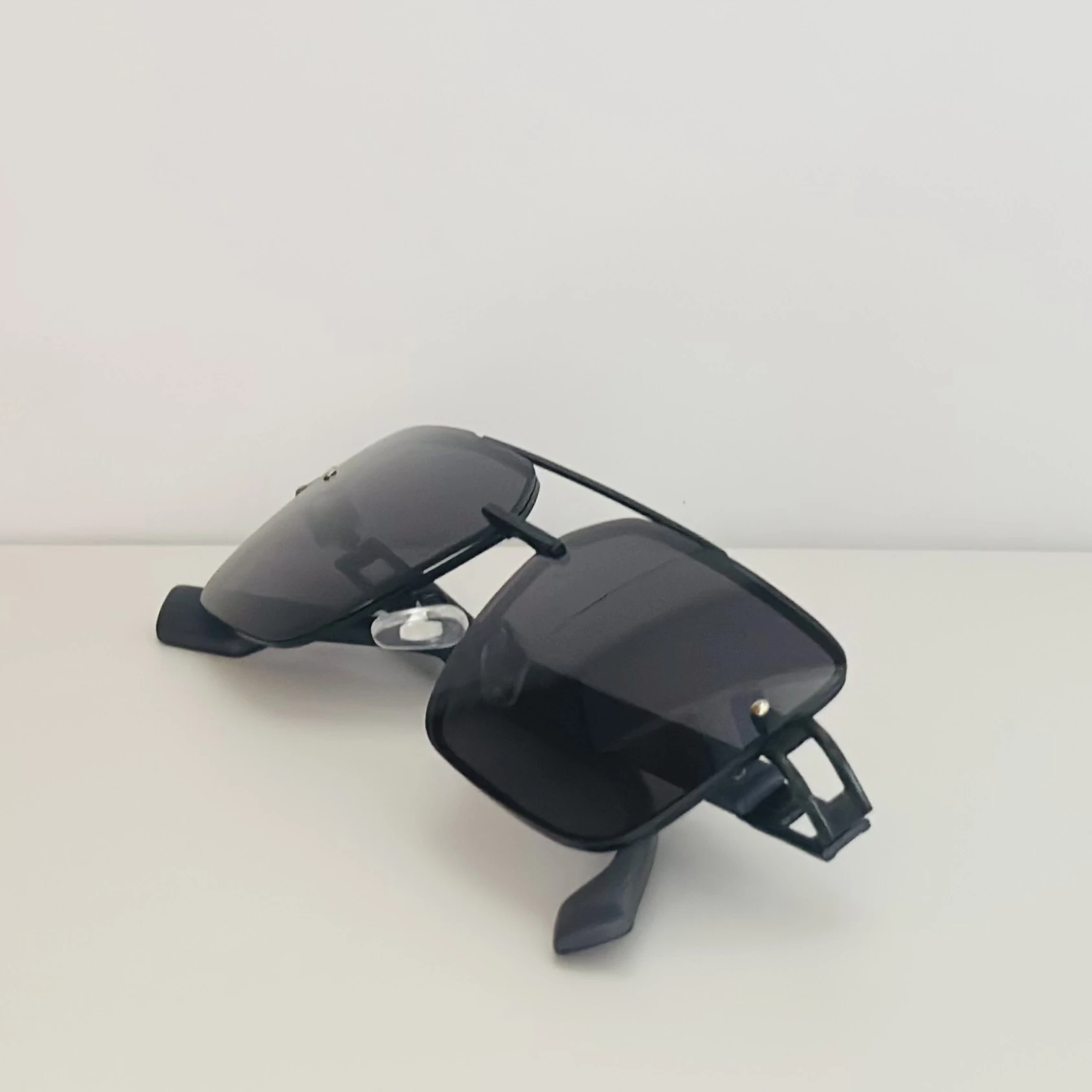 pair of black metal rectangular sunglasses.