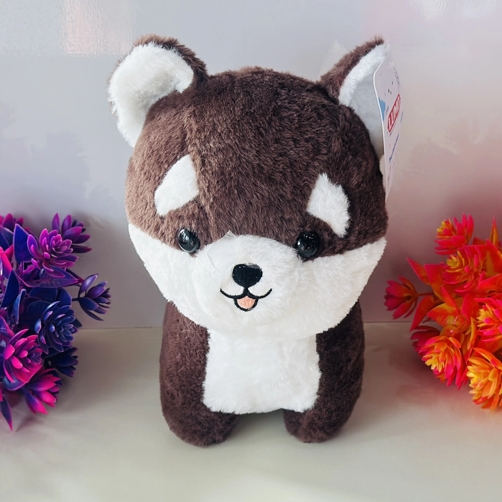Brown and white Husky or Shiba Inu dog plush toy.