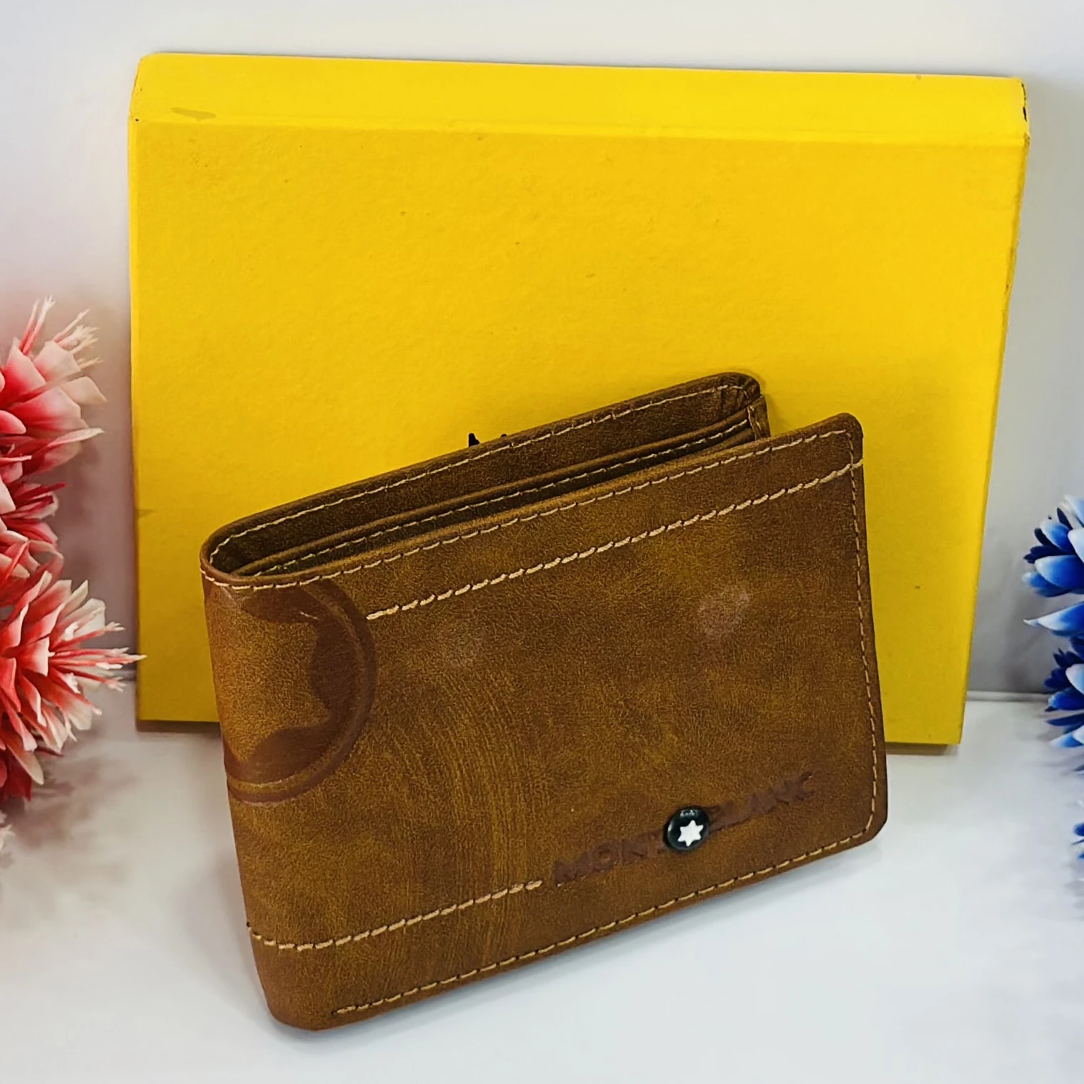 Brown bifold leather wallet in a Montblanc gift box.