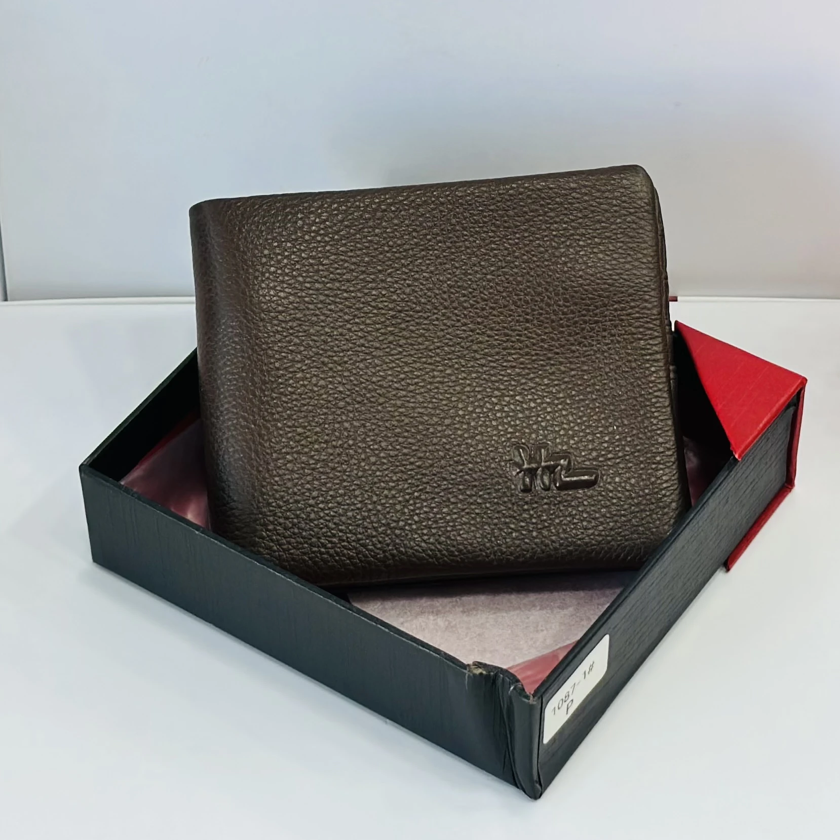 Brown leather bifold men's wallet.