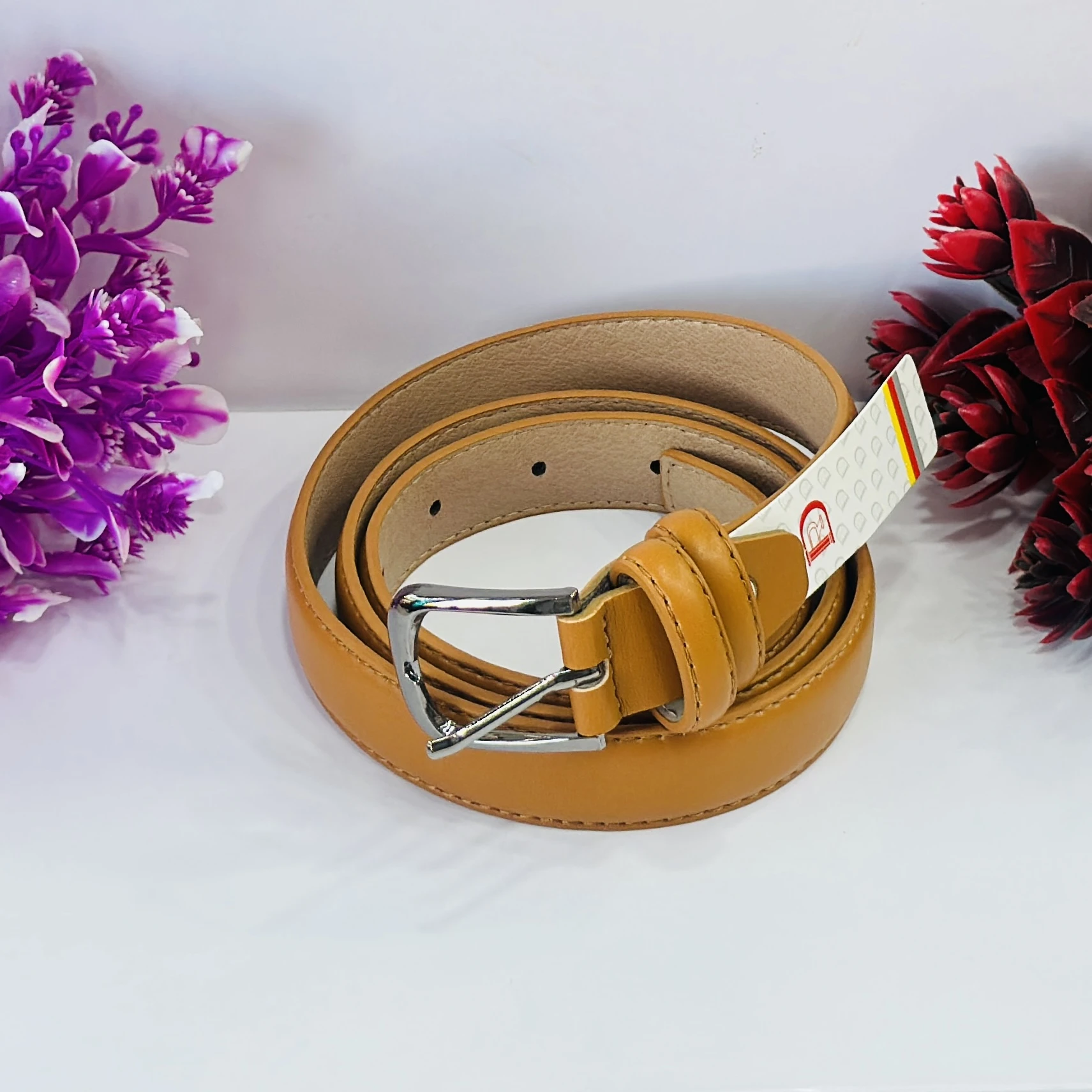 Tan or ocher-colored leather waist belt