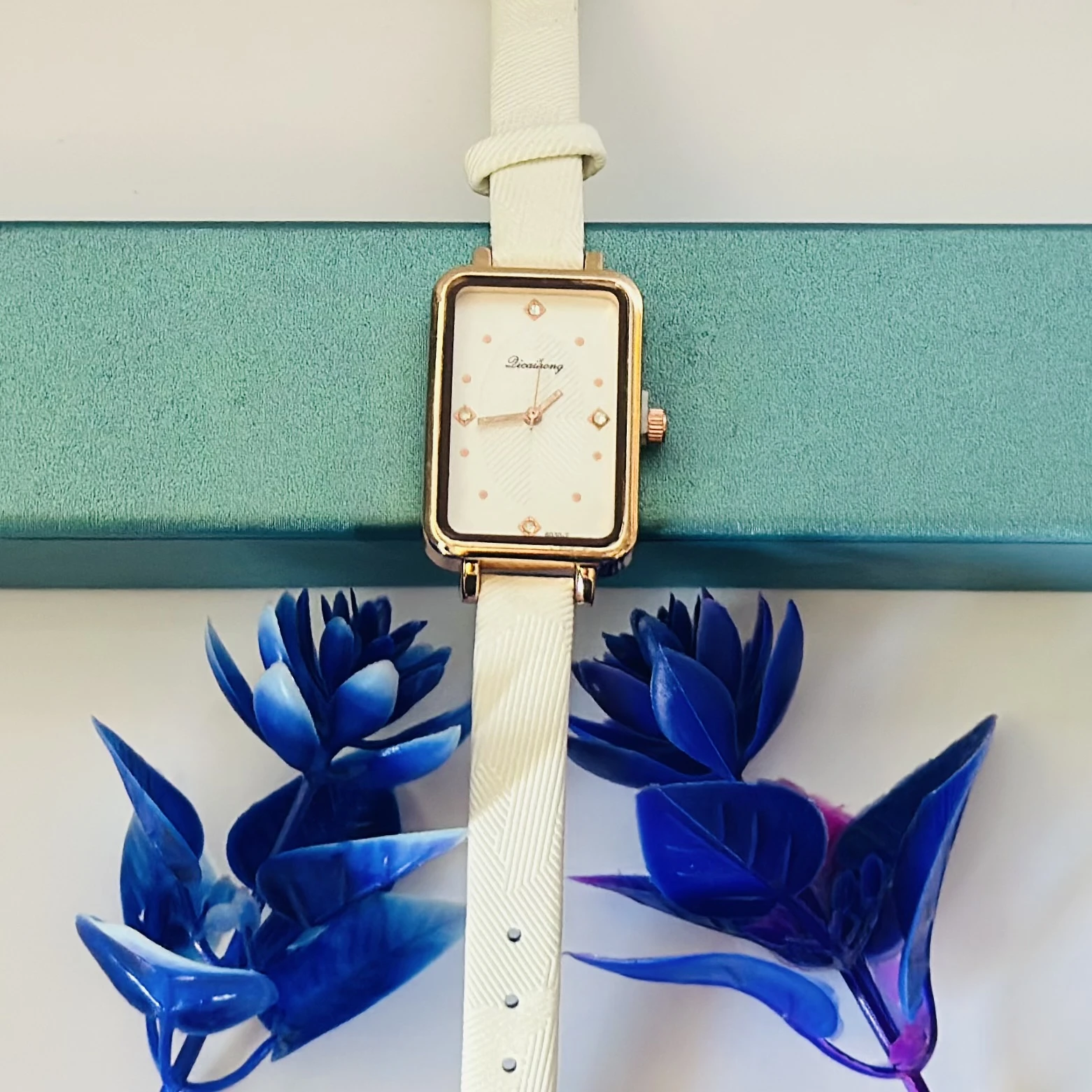 White Focus quartz analog watch for women with a white leather strap.