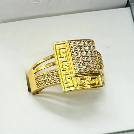 gold Greek Key cube engagement ring with diamonds.