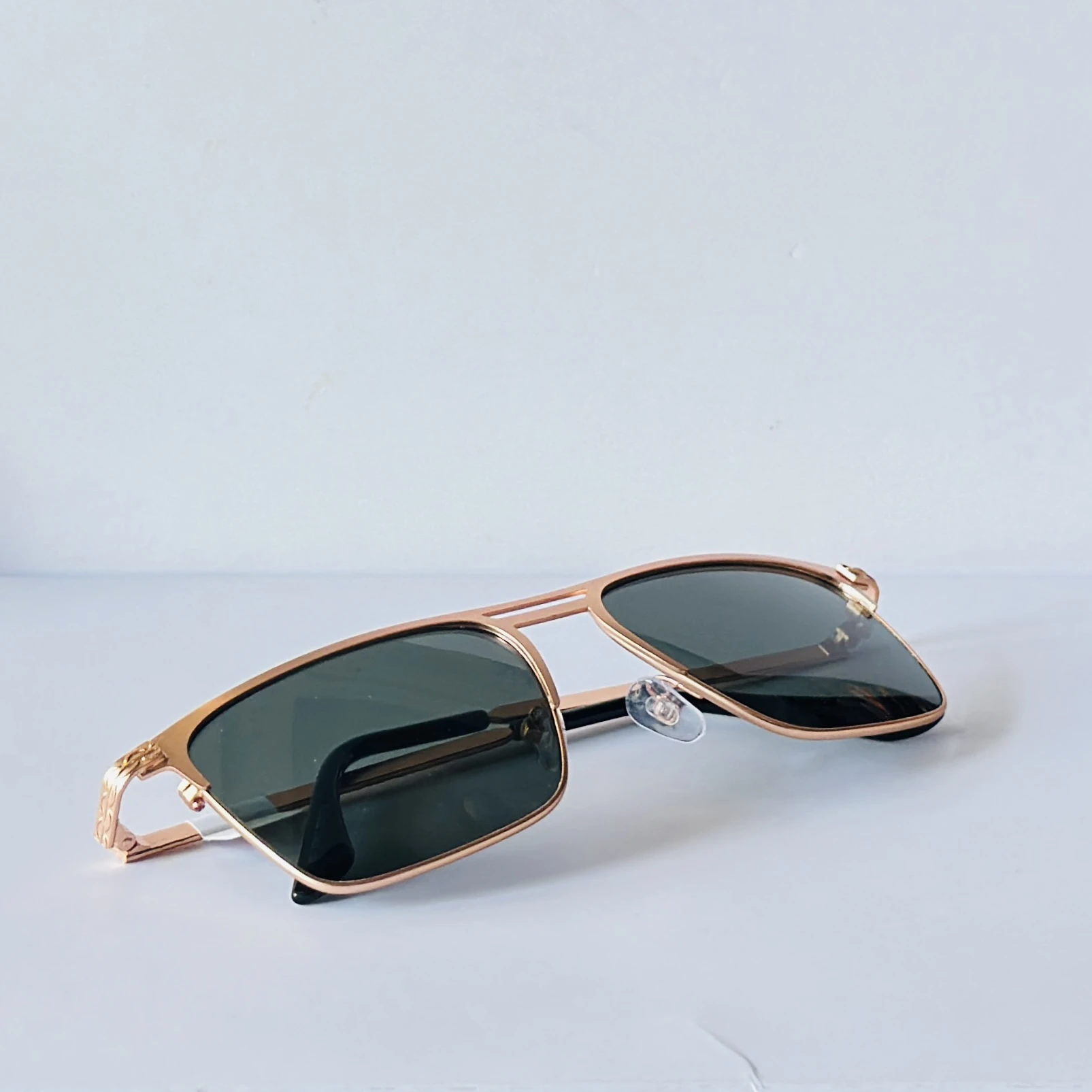 sunglasses appear to be the Vincent Chase