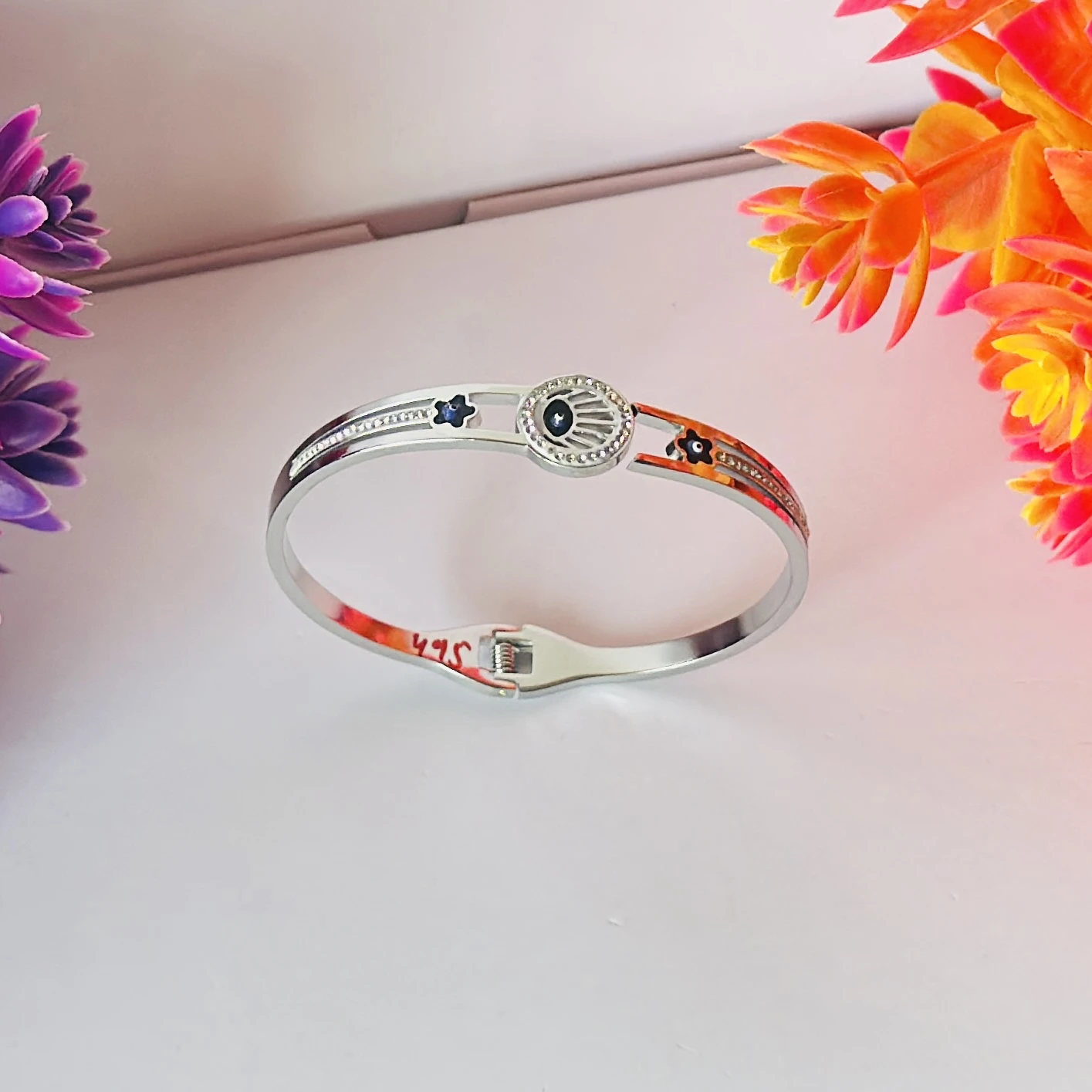 stainless steel silver-plated evil eye bangle bracelet.