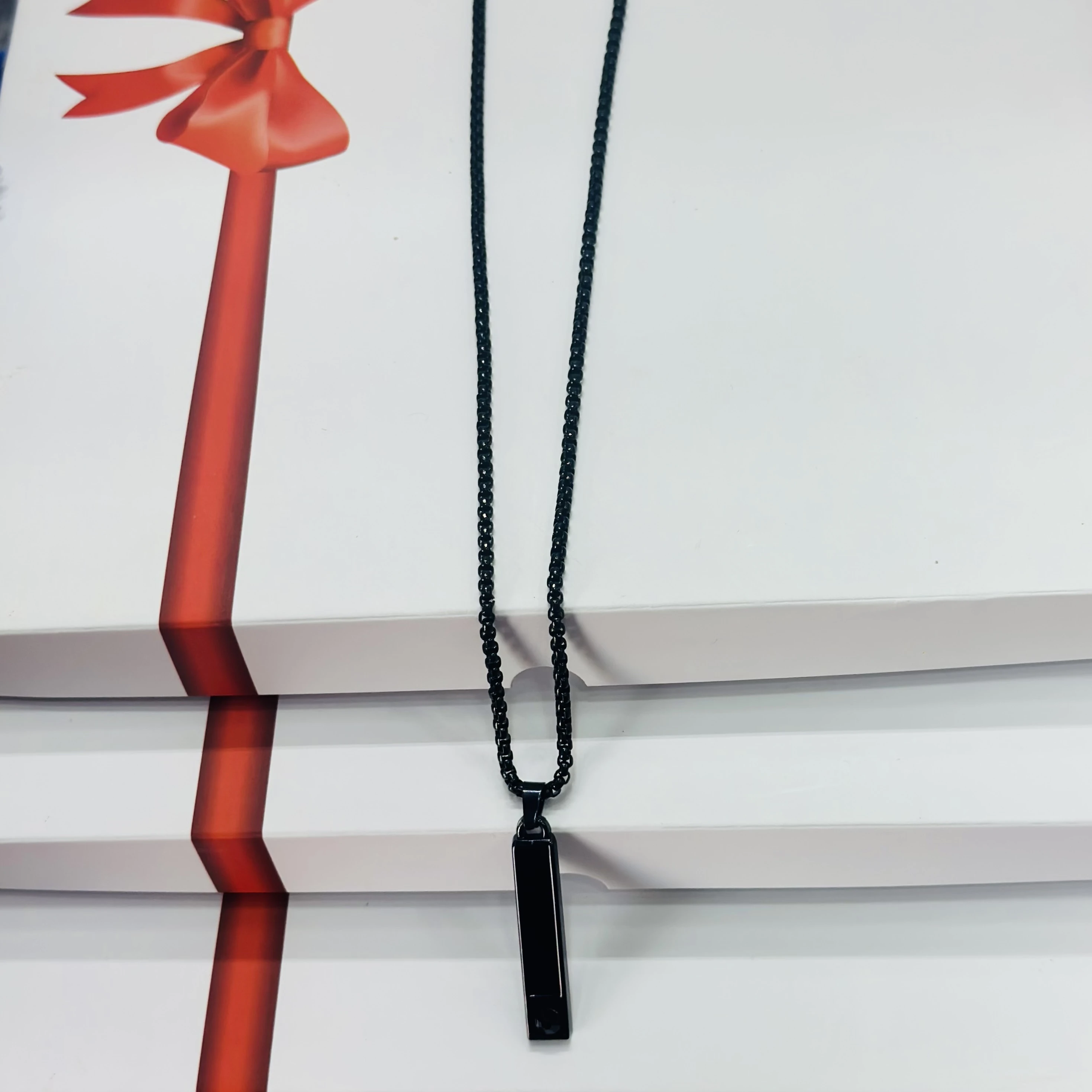 Black stainless steel anxiety relief mindful breathing necklace.