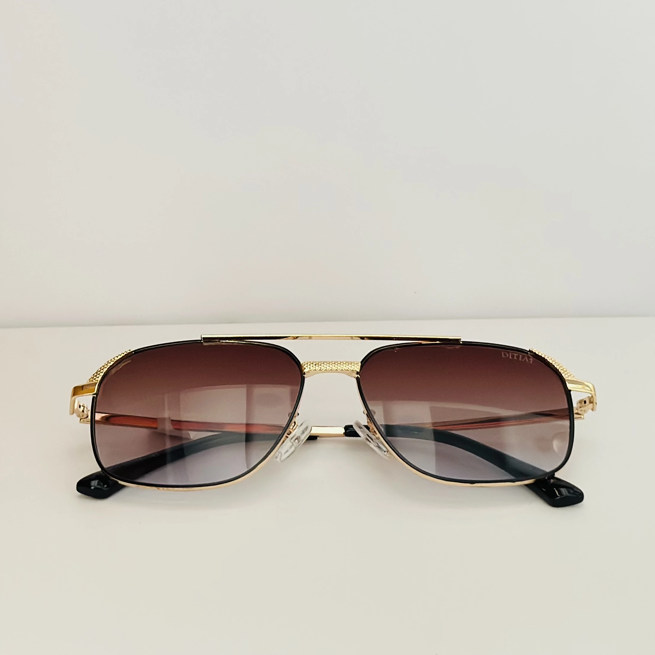 Vincent Chase by Lenskart brown square sunglasses with a golden frame