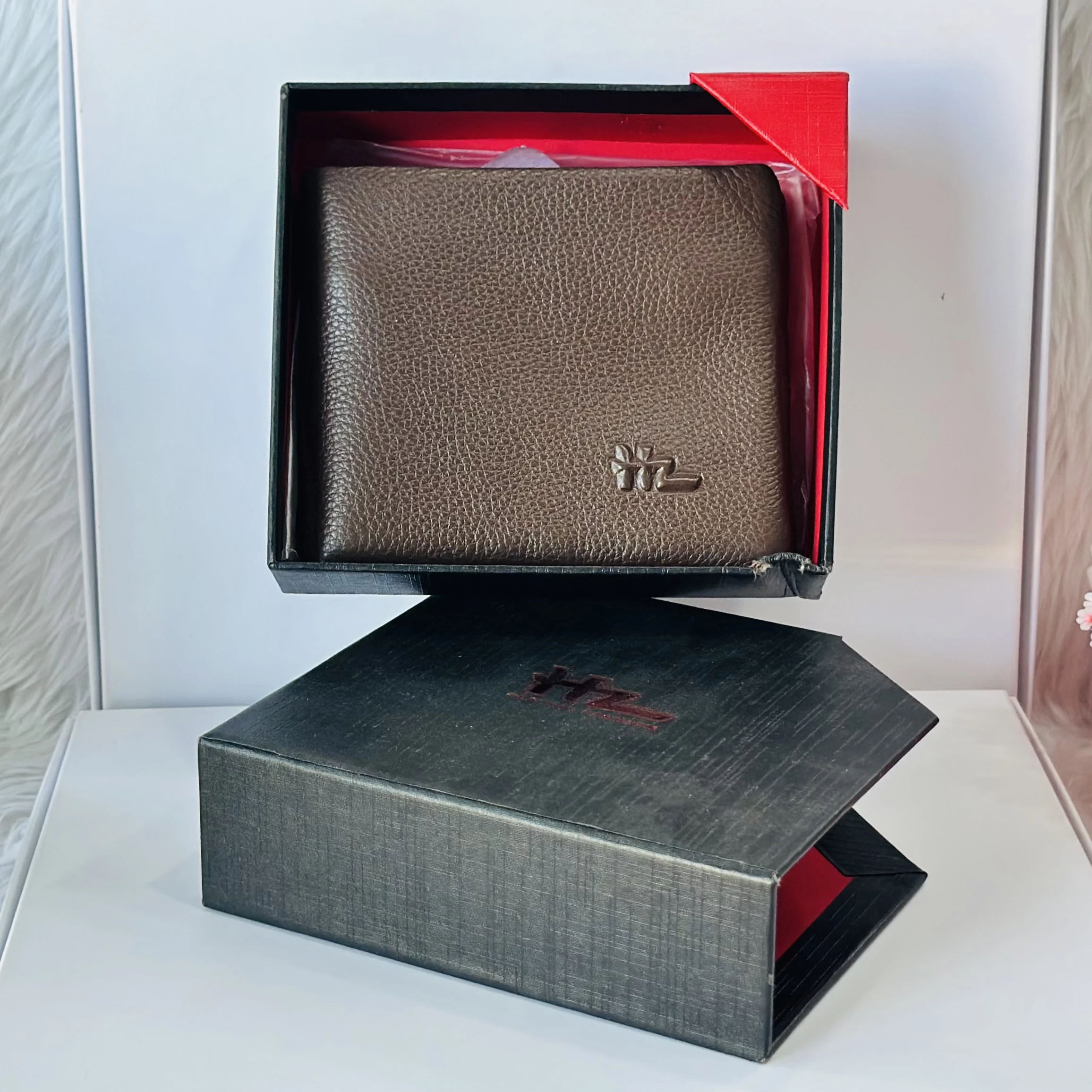 Brown leather bifold men's wallet.