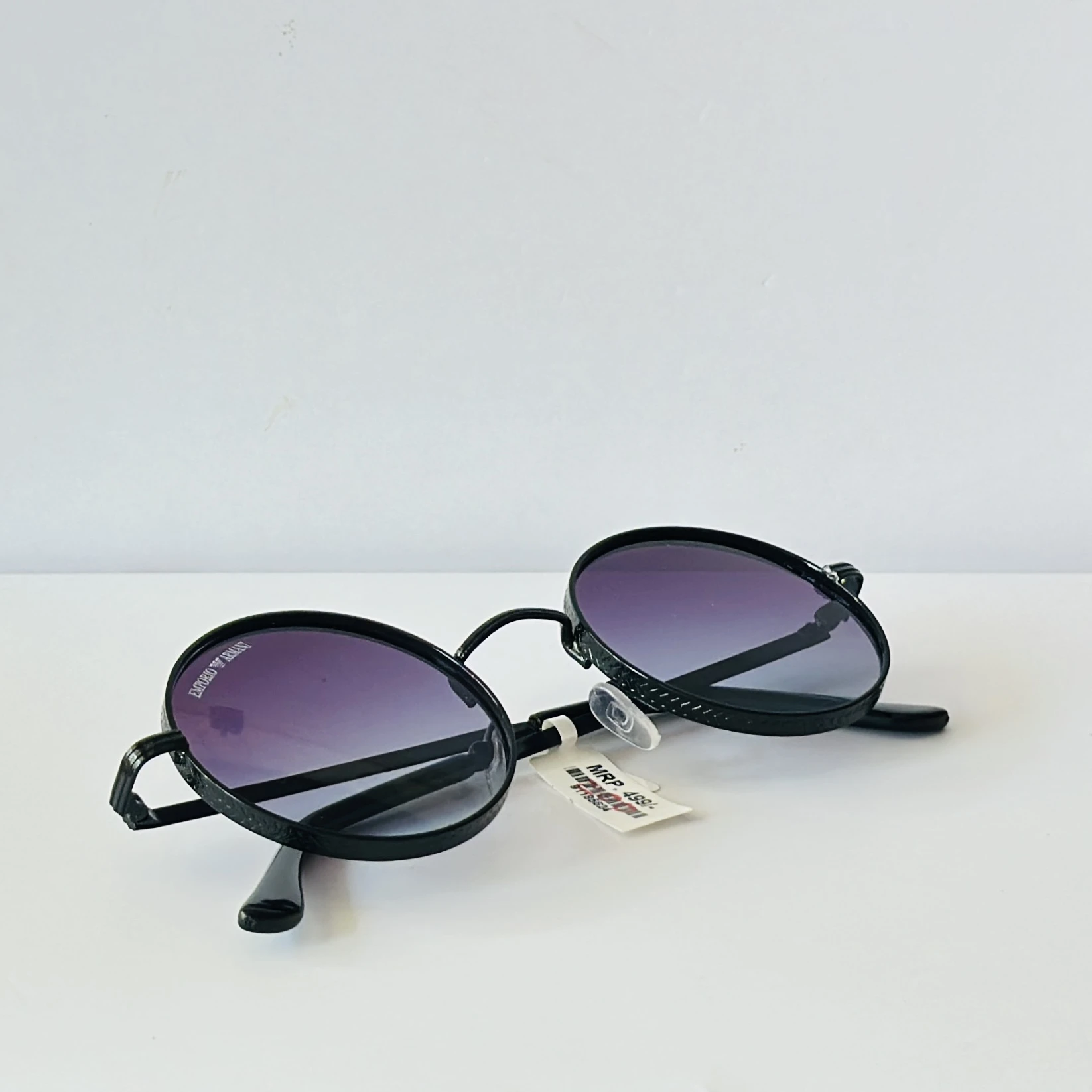 pair of round purple-tinted sunglasses