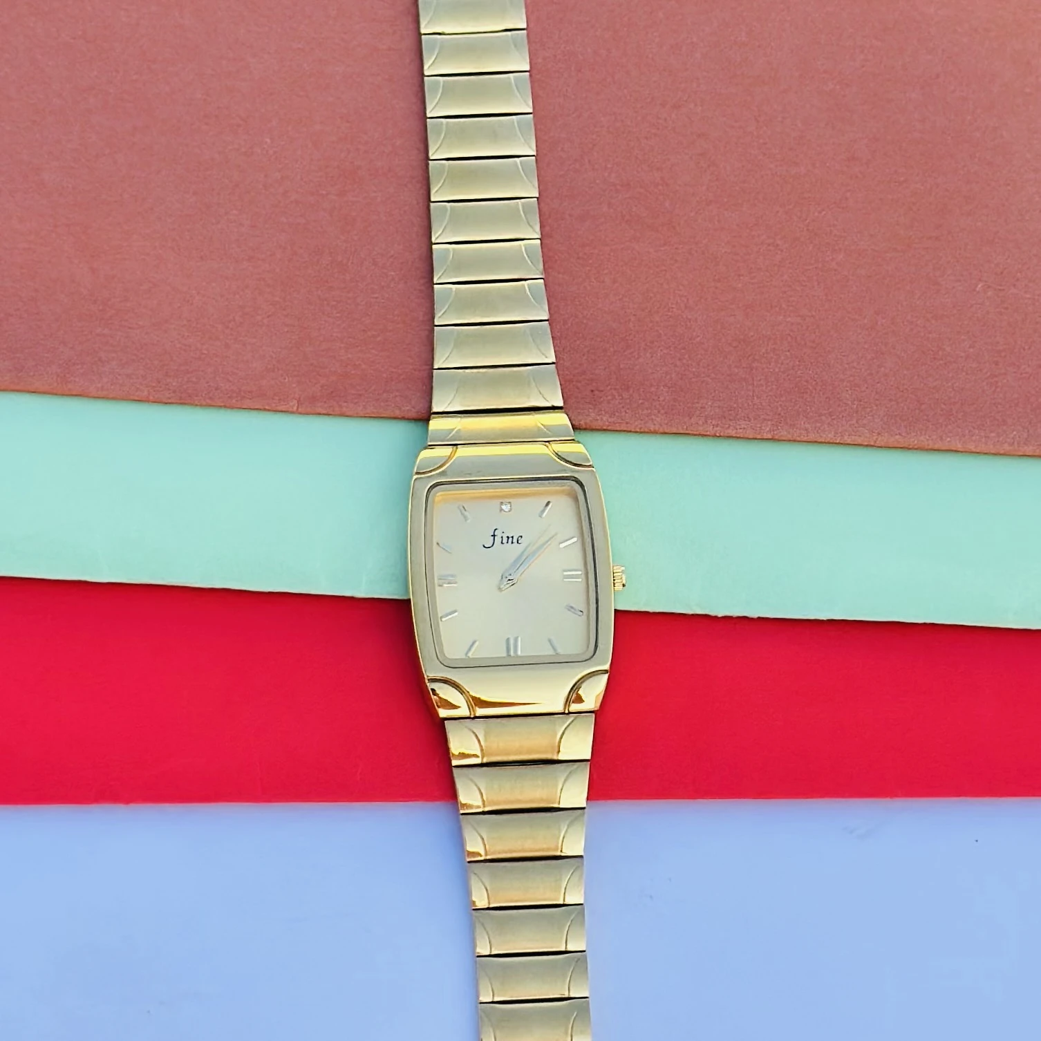 Gold tone analog wrist watch