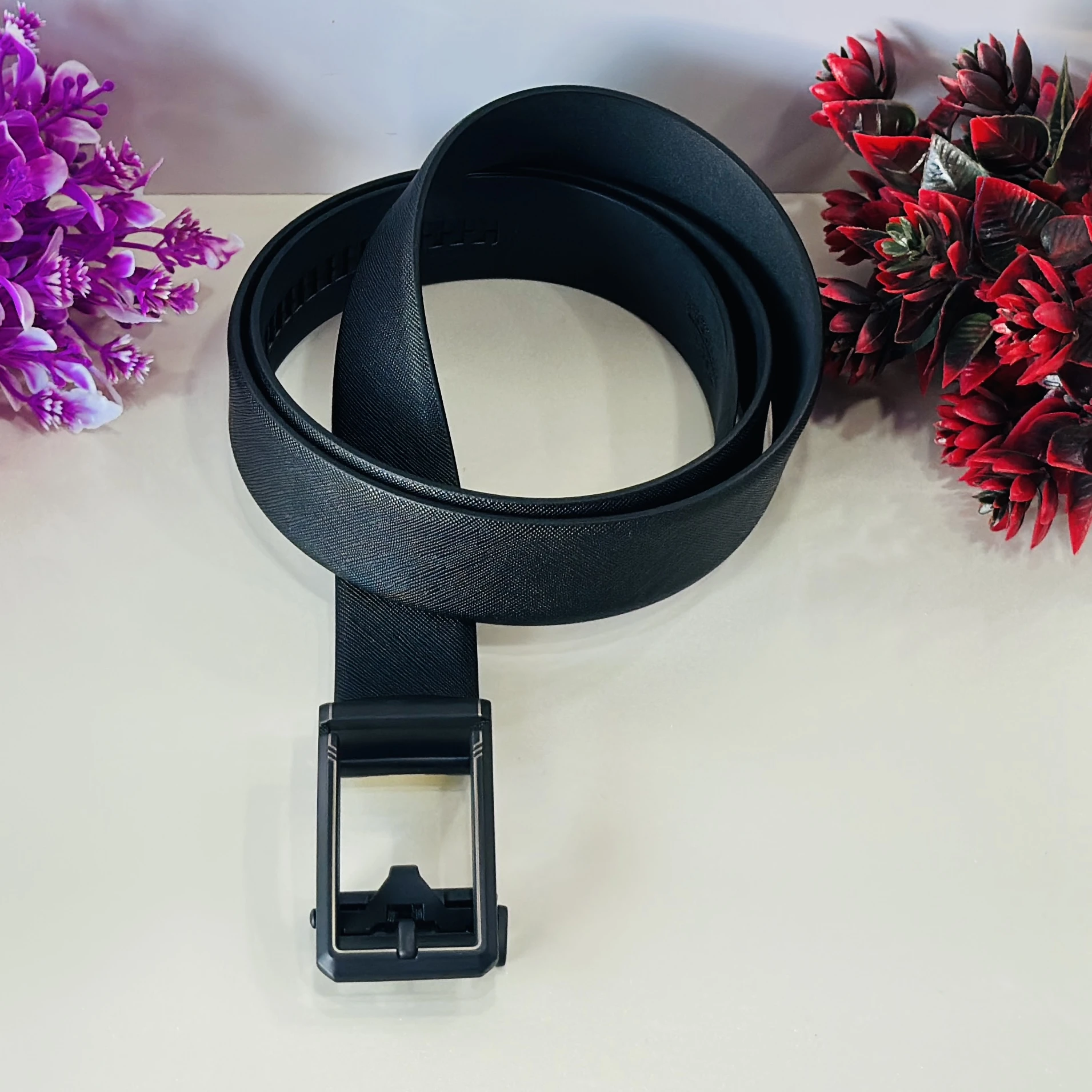 Black Saffiano leather reversible belt with a gunmetal buckle.
