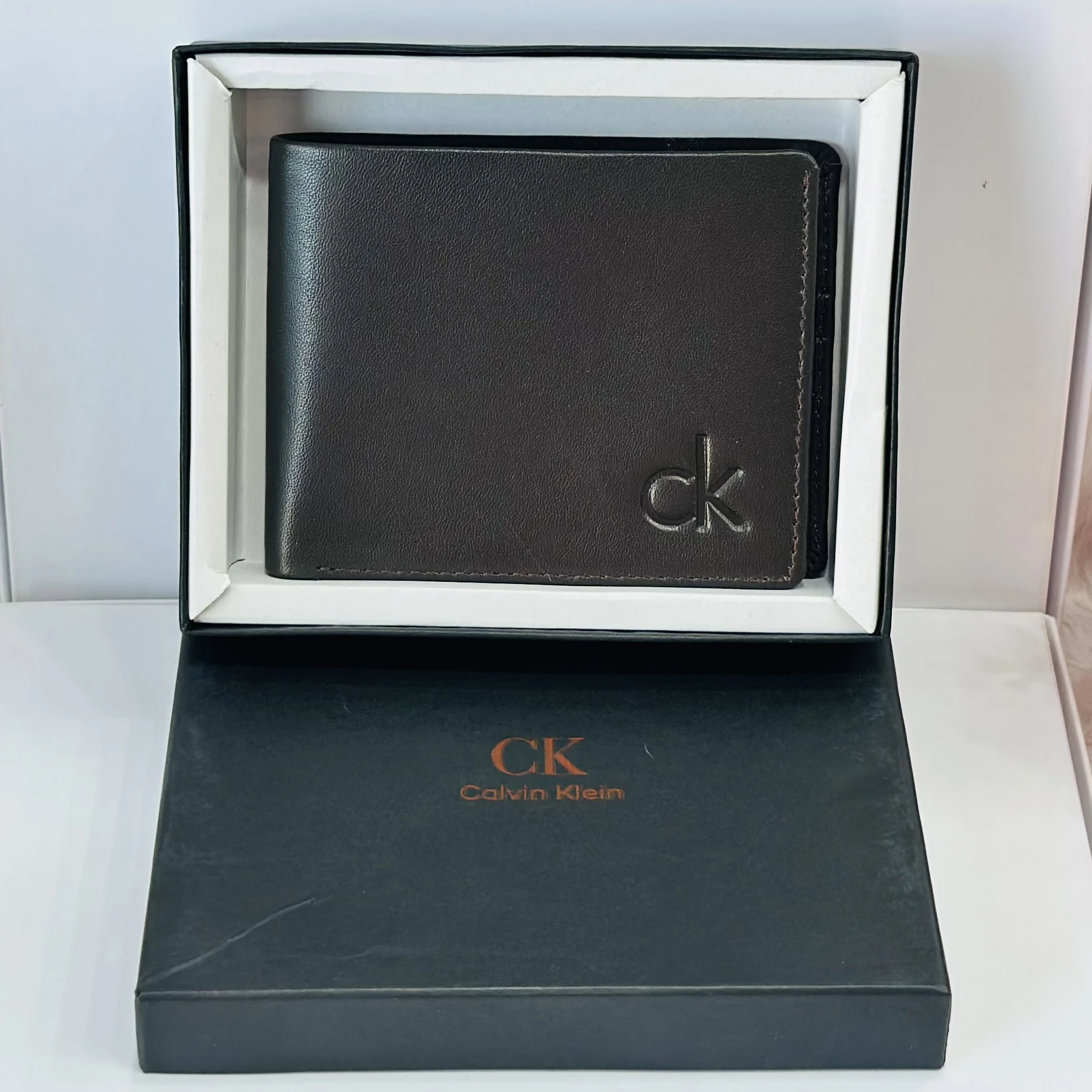 Calvin Klein men's bi-fold leather wallet in brown.
