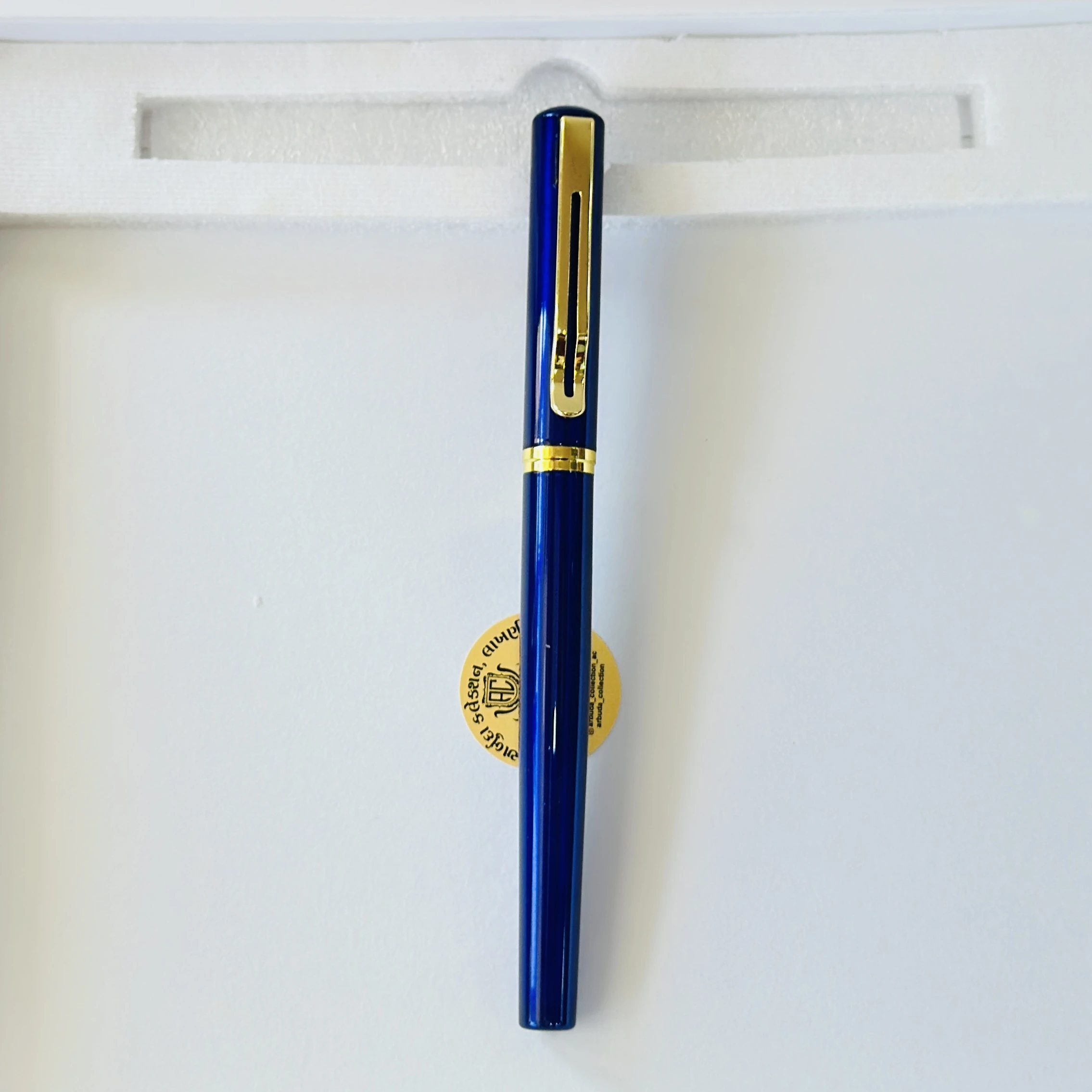 Blue metallic rollerball pen