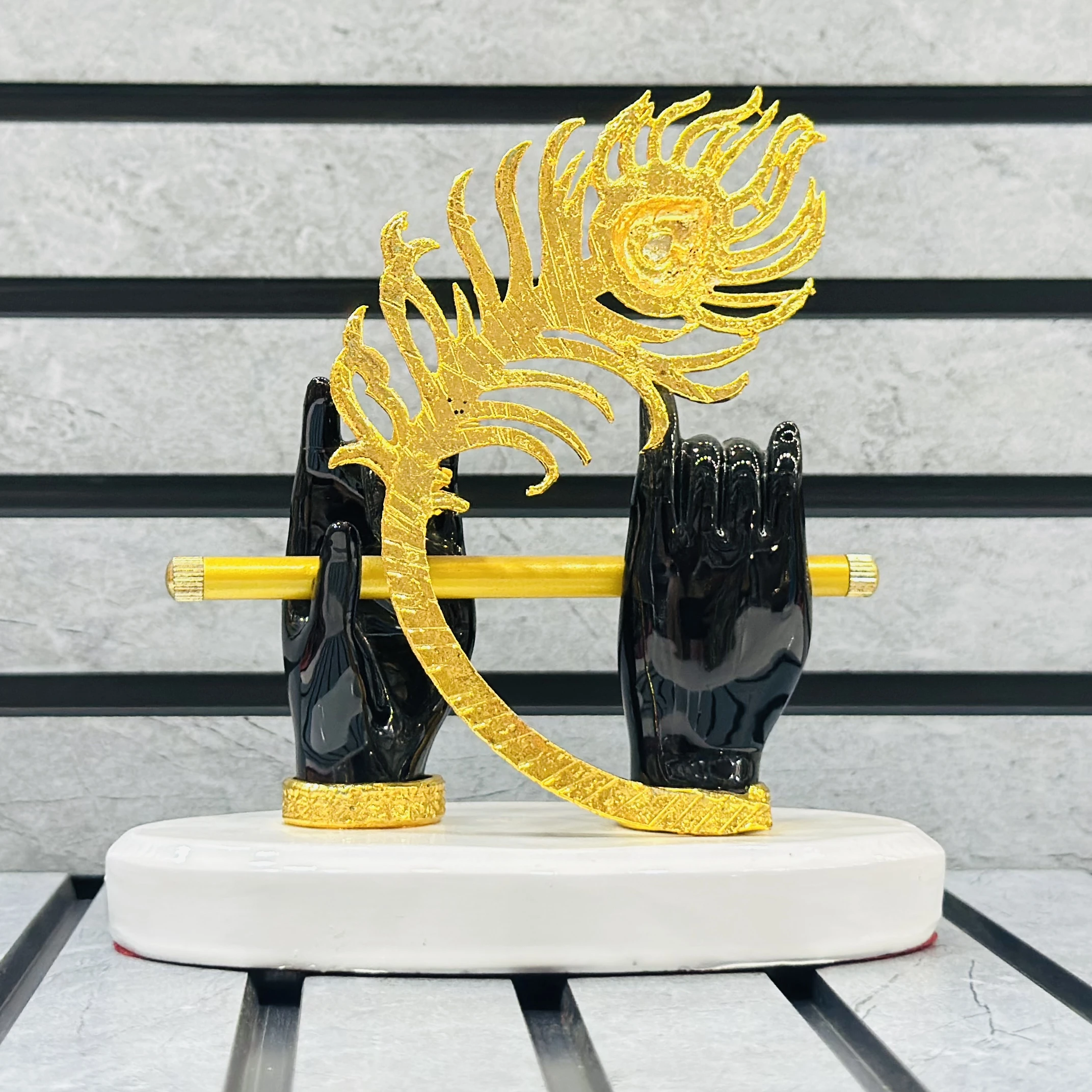 Gold plated Lord Krishna hands with flute and peacock feather figurine.