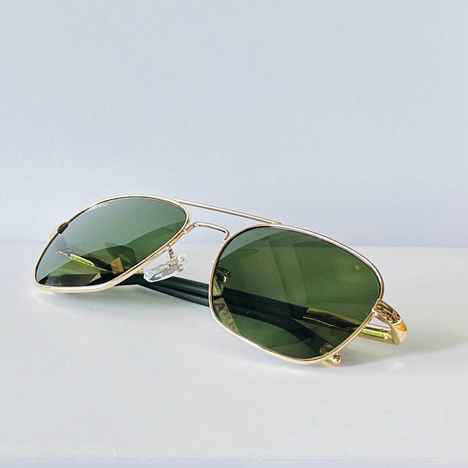 appear to be retro square or aviator-style sunglasses