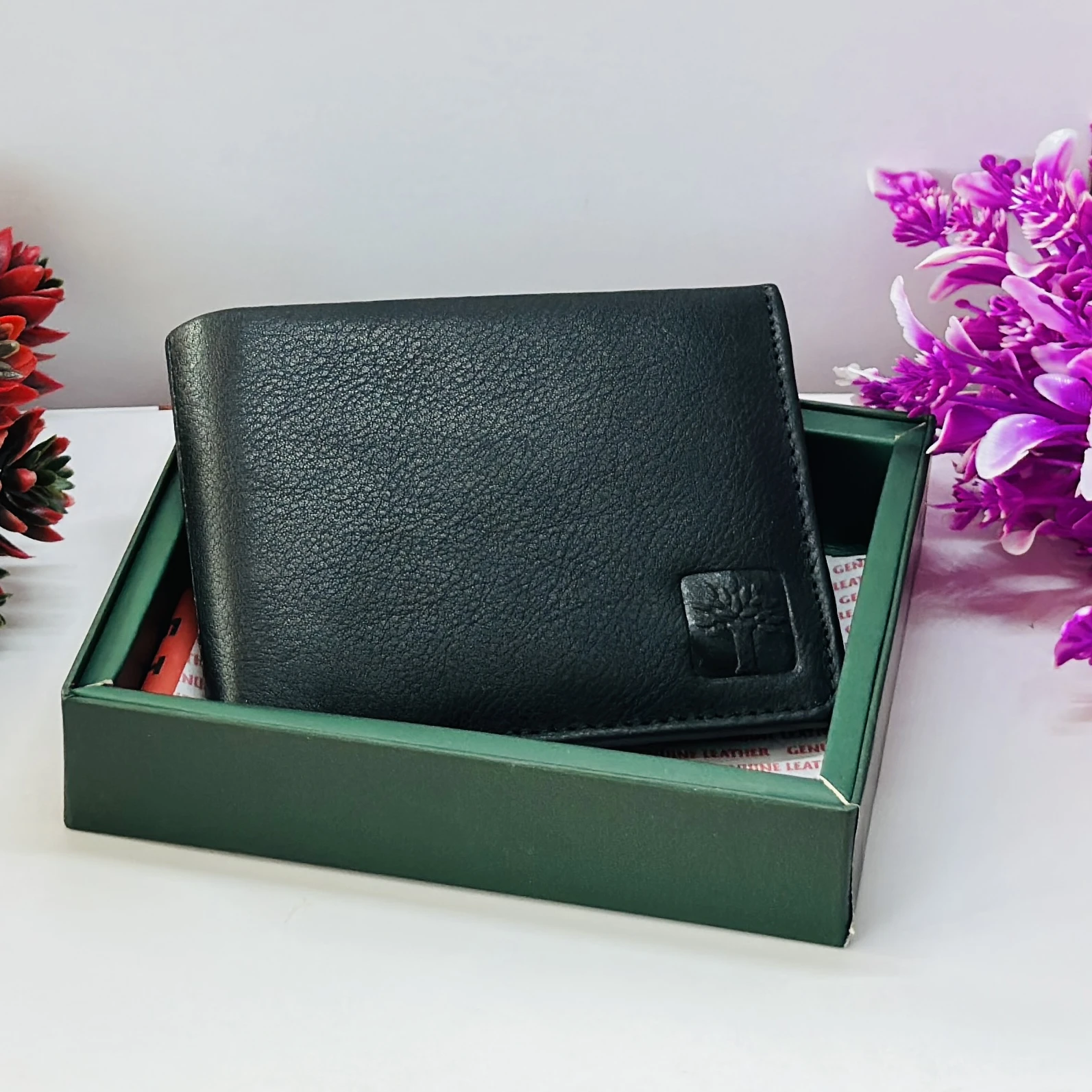 Woodland Men's black genuine leather bi-fold wallet.