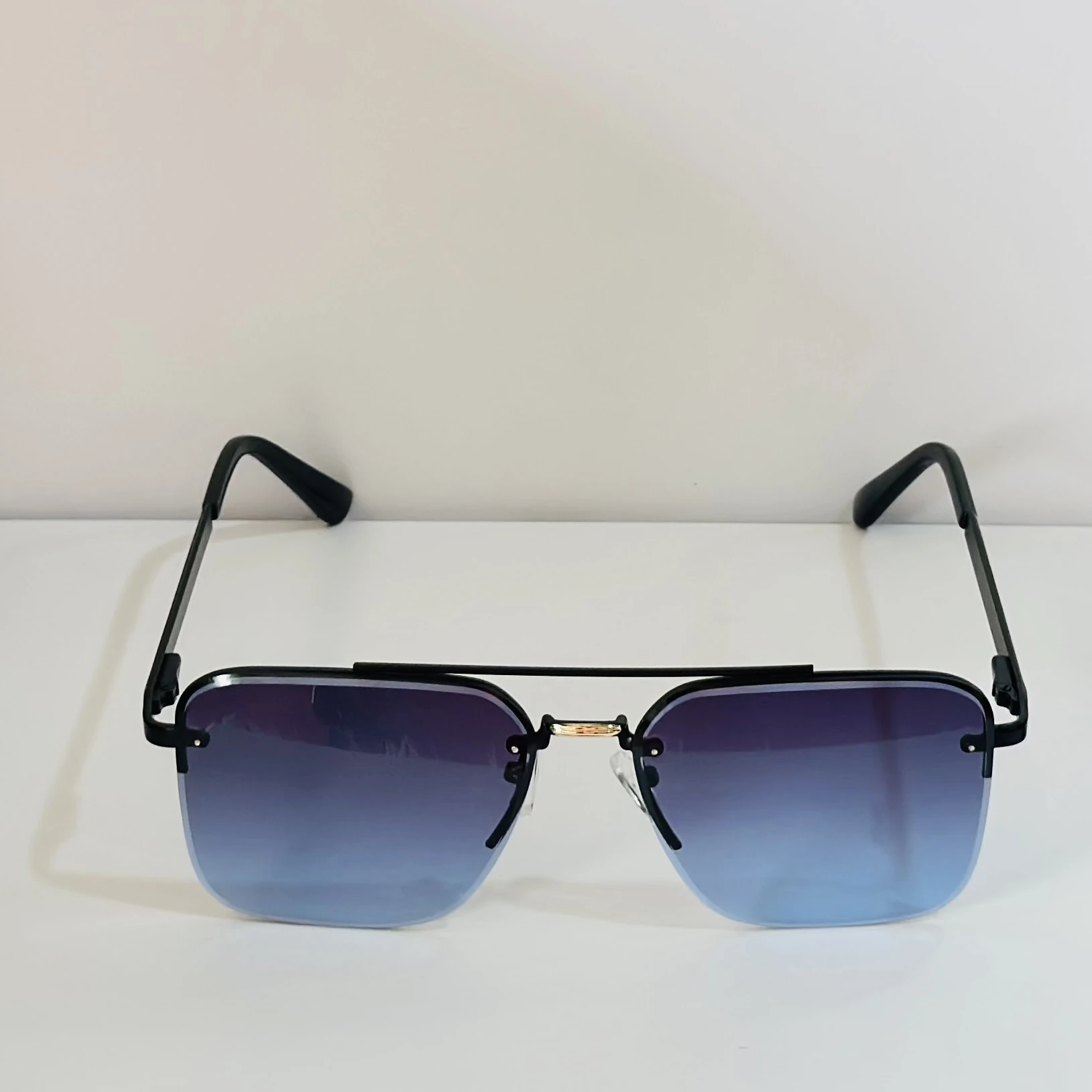 pair of Grey Jack Retro Square or Iron Man Square sunglasses with blue and grey lenses and a black frame.