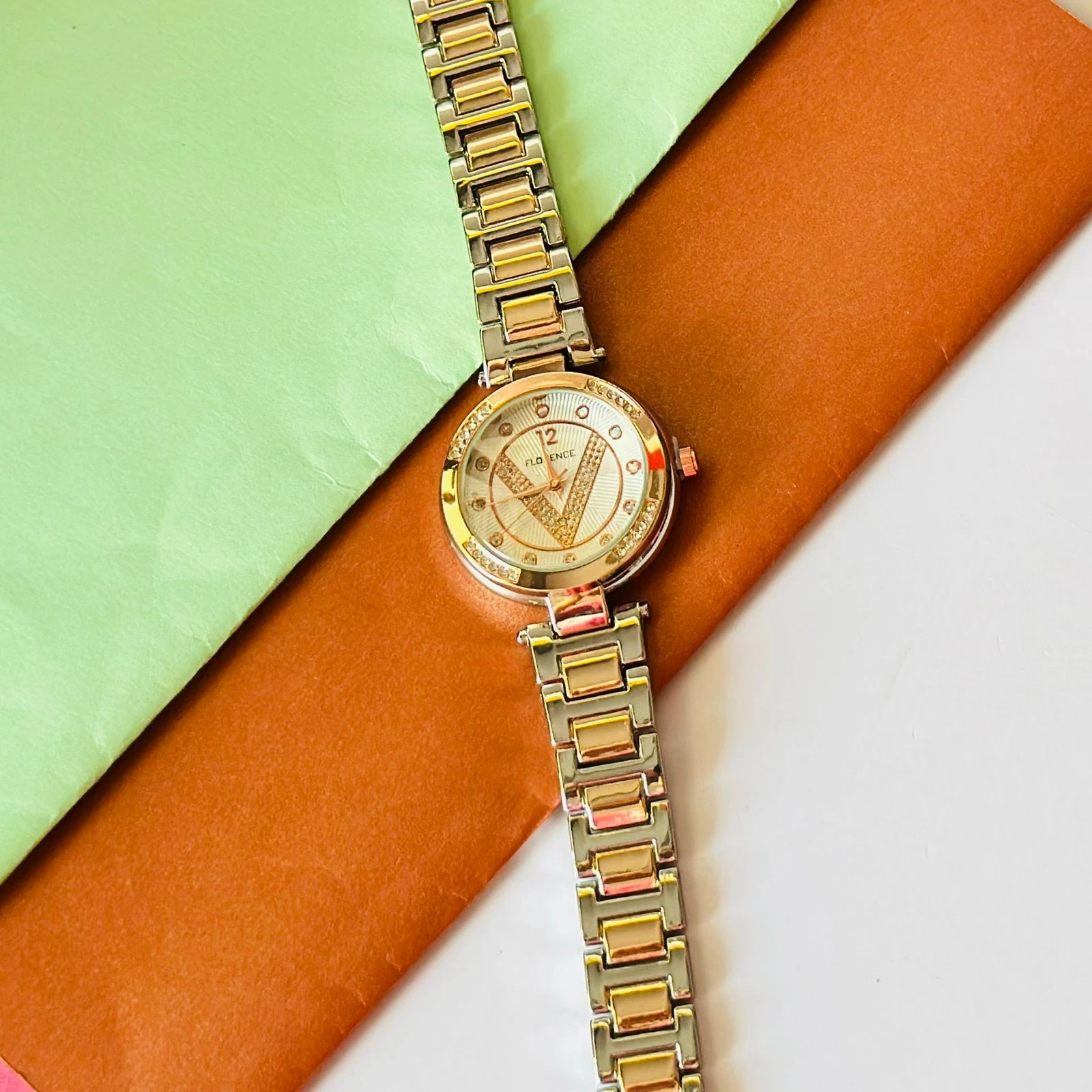 Florence brand two-tone metal analog watch for women.