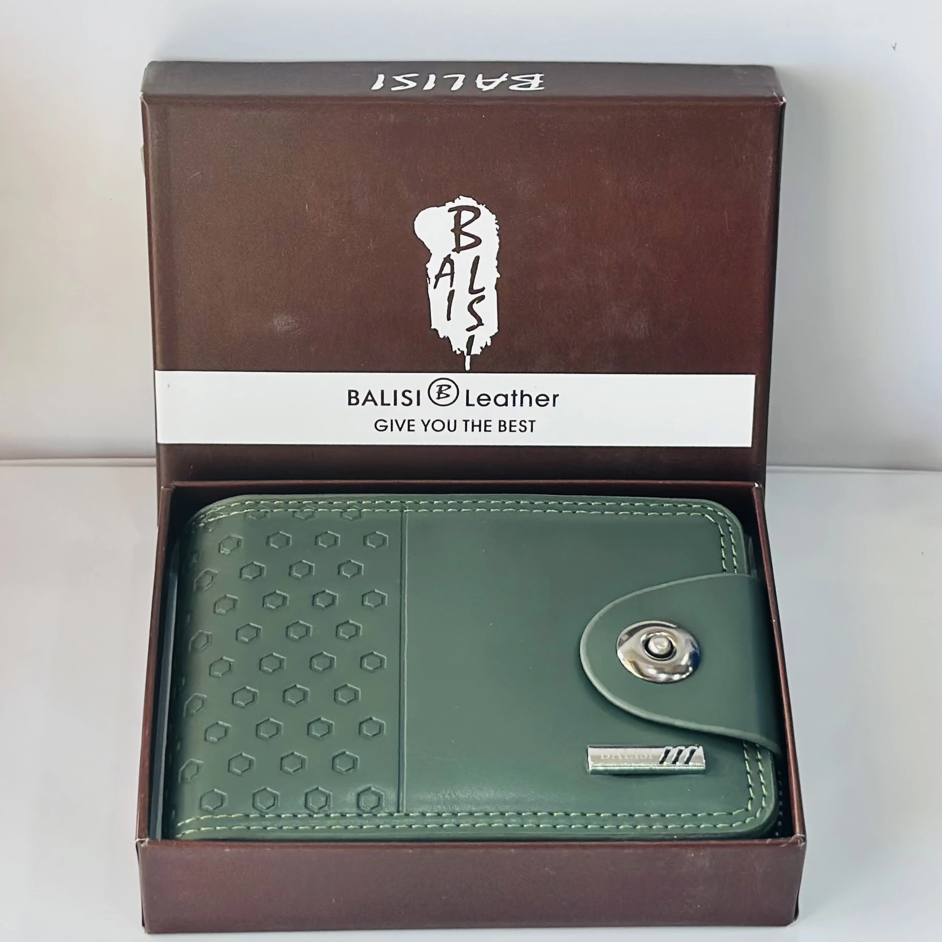 Balisi green leather wallet with a button closure.