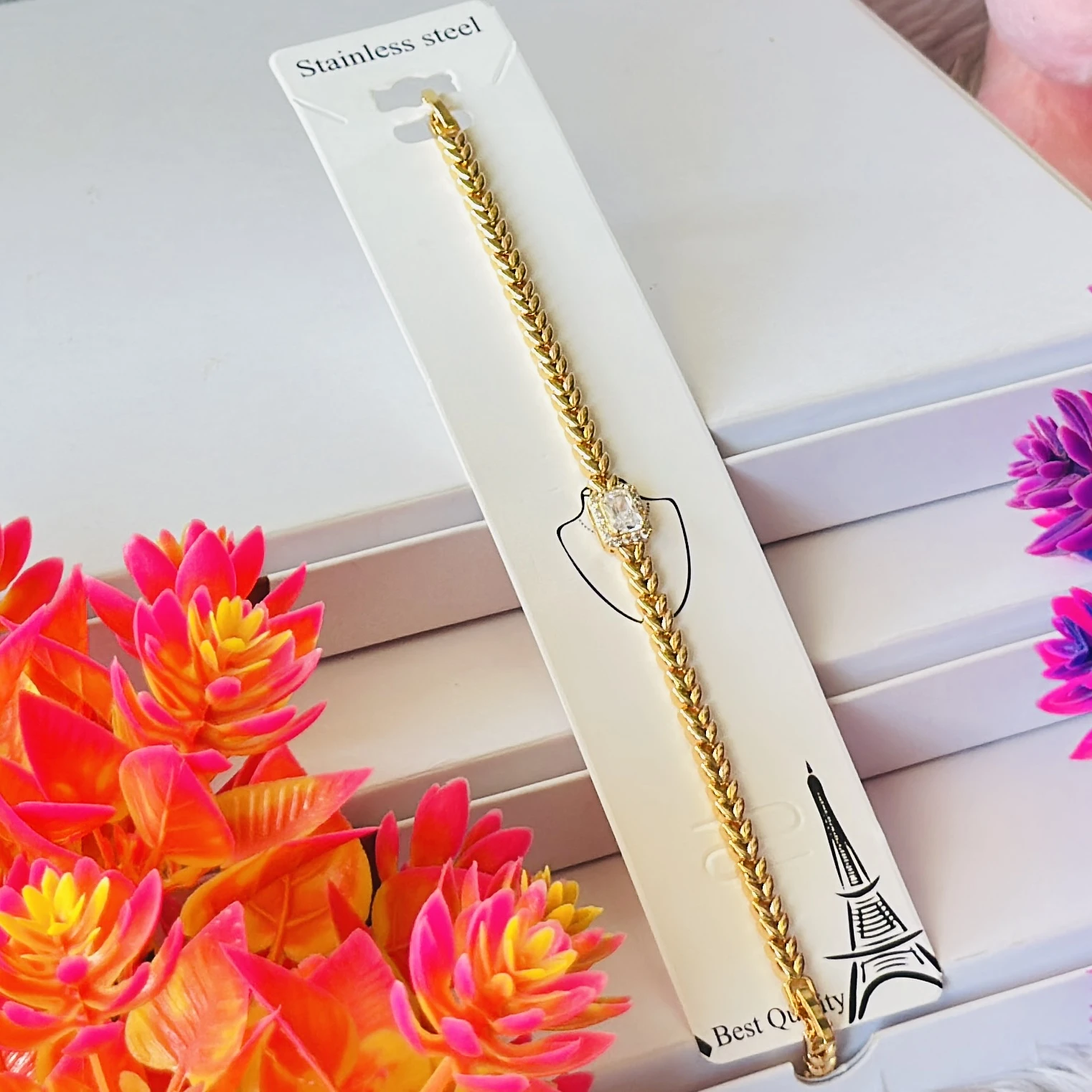 Gold plated bracelet with a central cubic zirconia stone