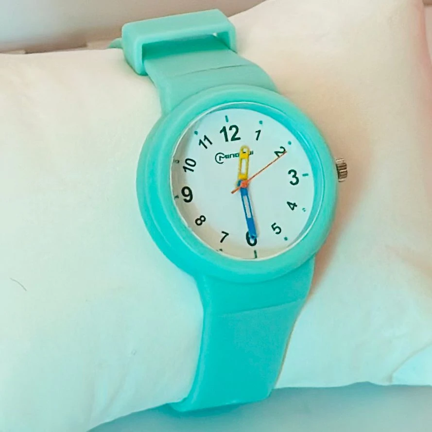 Mingrui analog quartz watch with a black silicone or plastic strap.