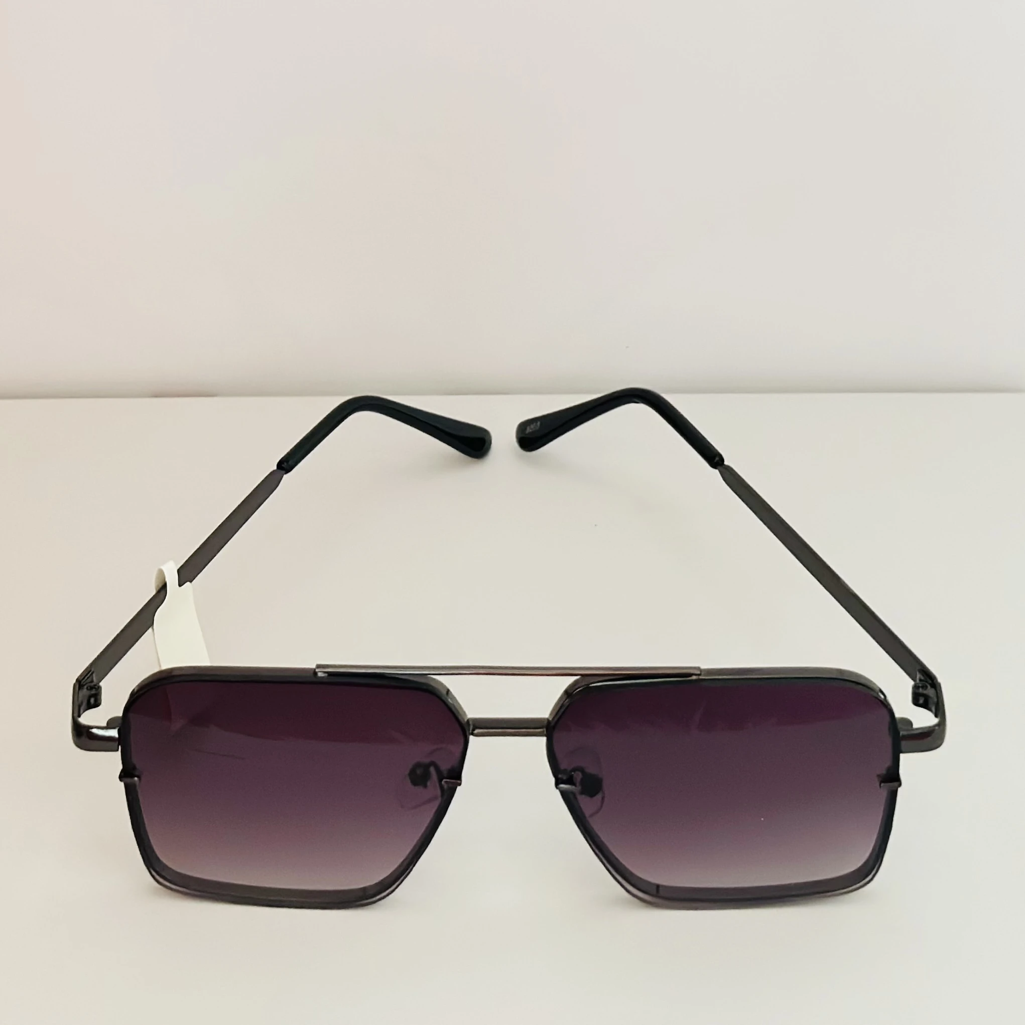 pair of square aviator gradient sunglasses with a black metal frame.