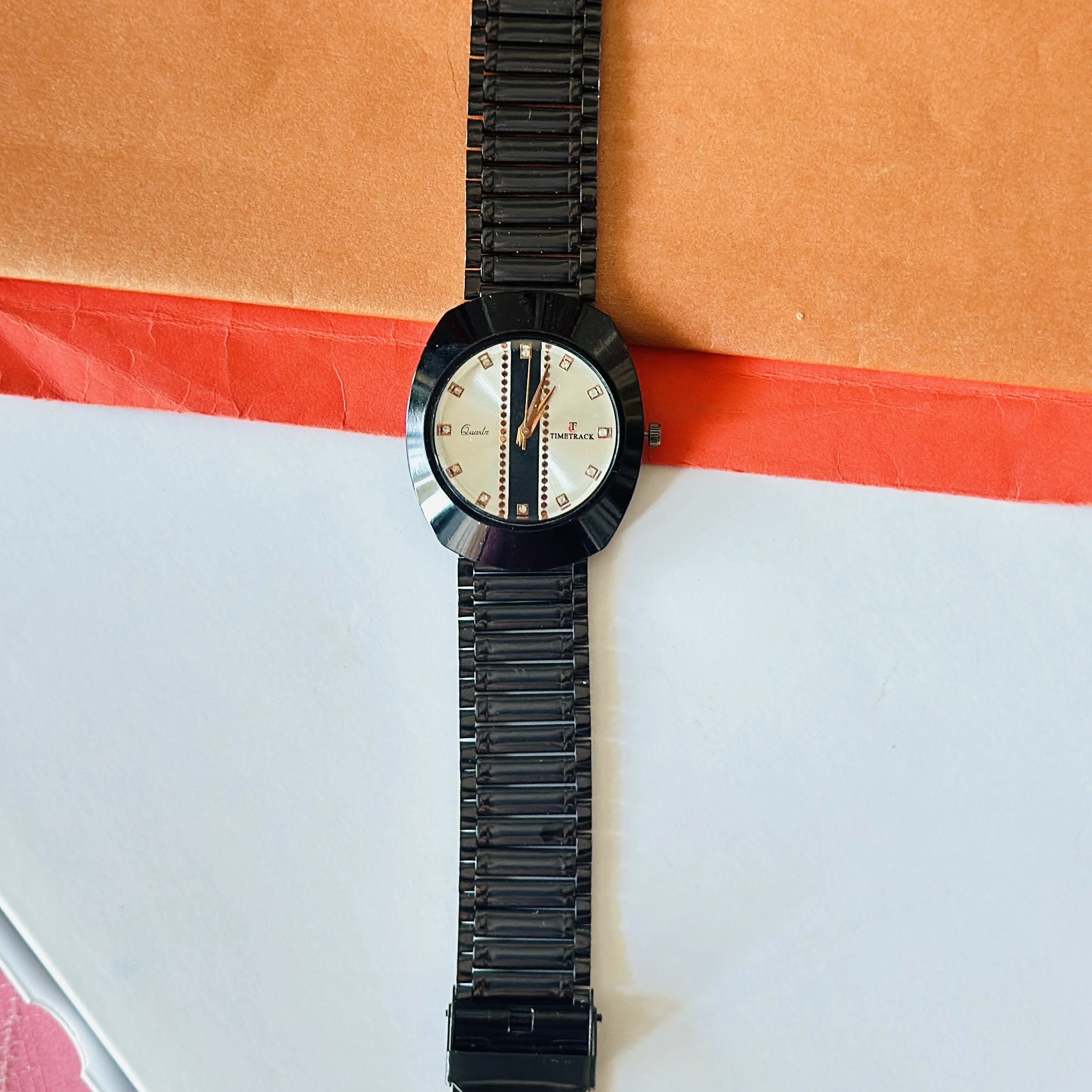 Diastar analog watch with a black metal strap and a silver dial