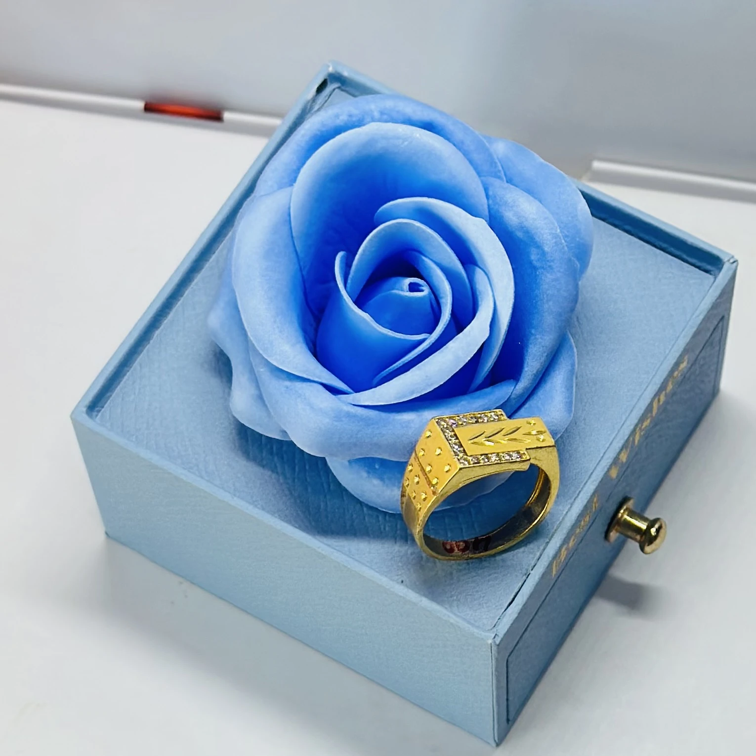 1 gram gold-plated men's ring with a rectangular face and side stone accents