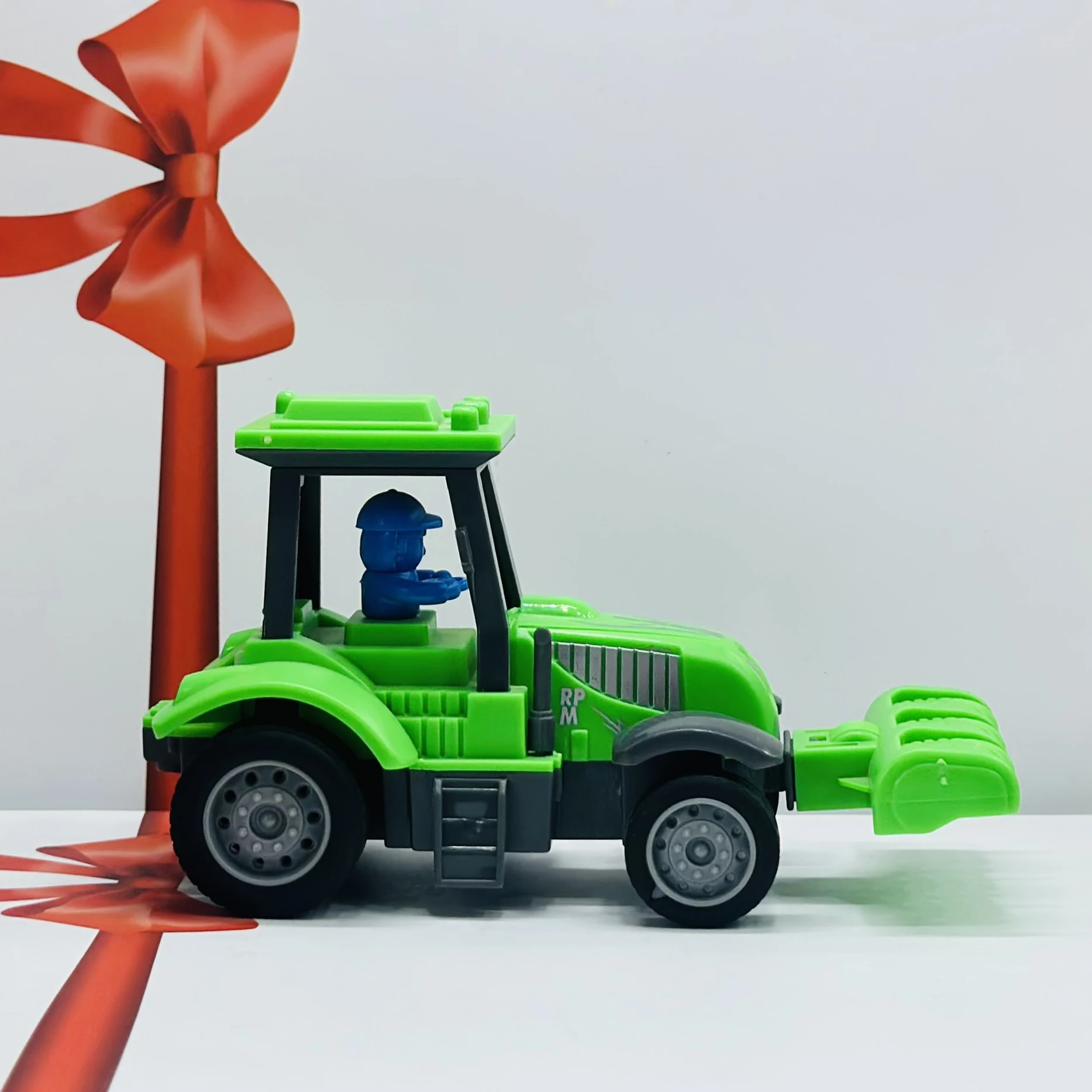 Green plastic toy tractor