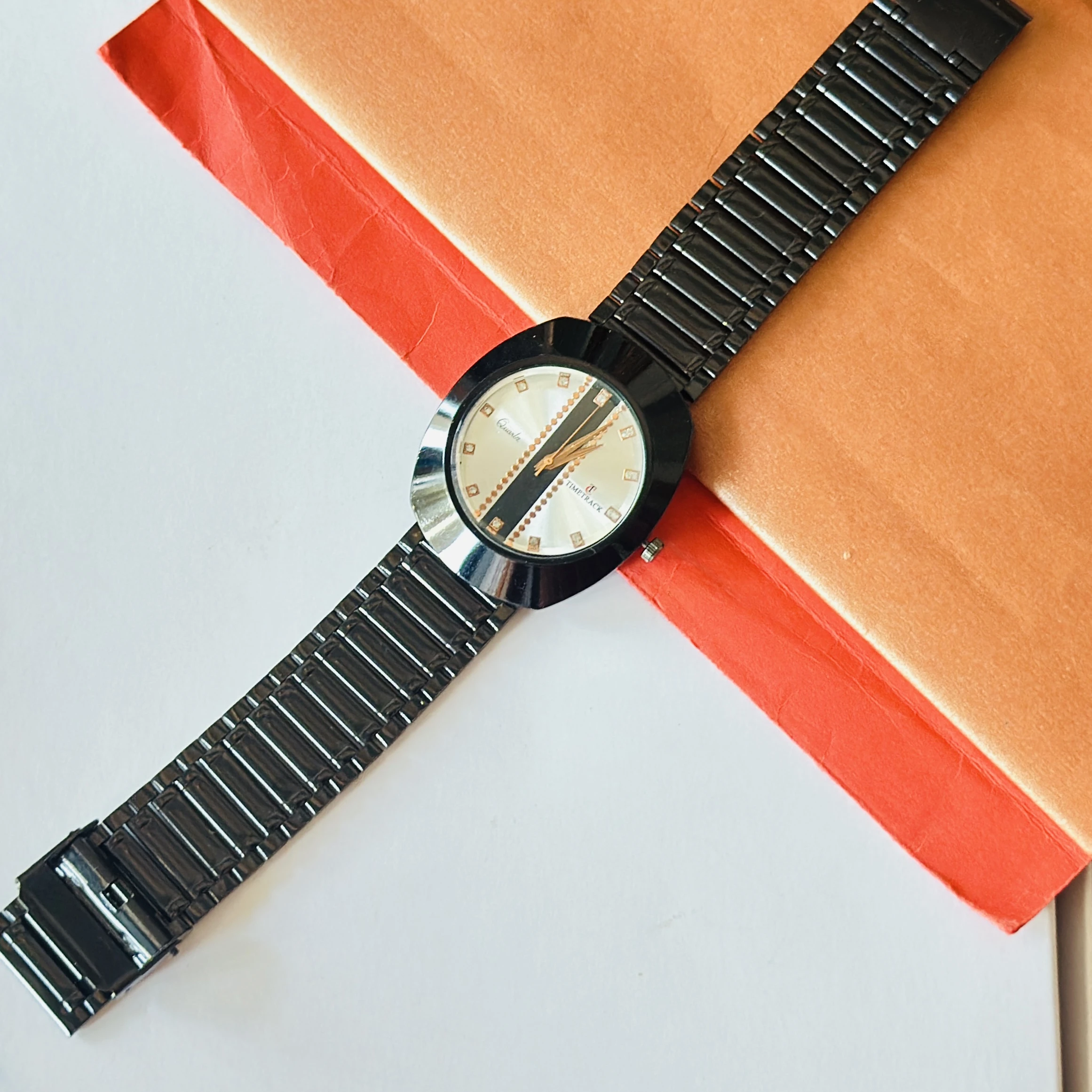 Diastar analog watch with a black metal strap and a silver dial
