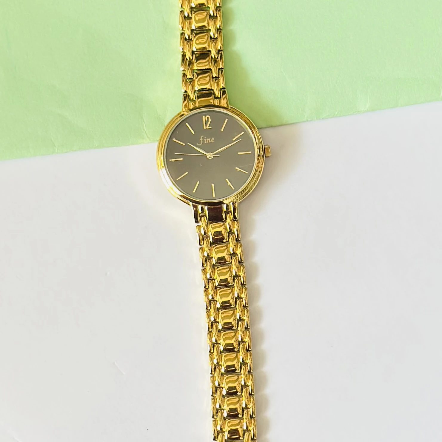 Gold tone metal strap watch