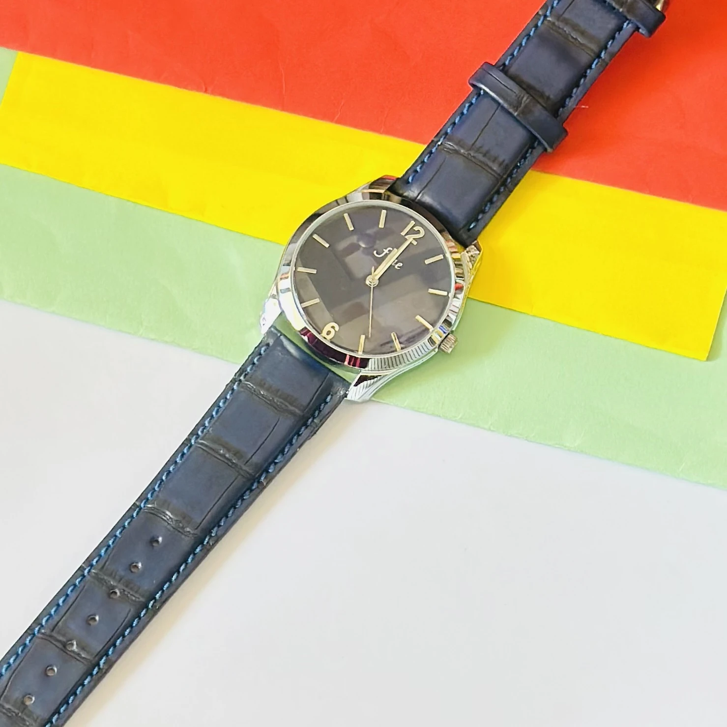 Analog watch for men with a blue faux-crocodile leather strap.