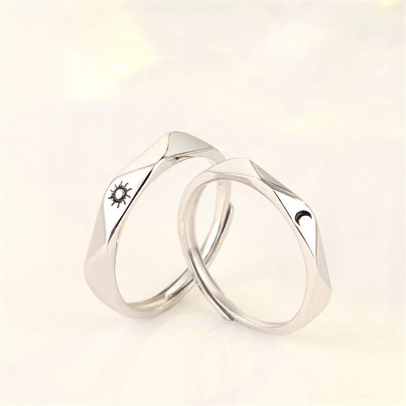 Set of silver-toned couple rings