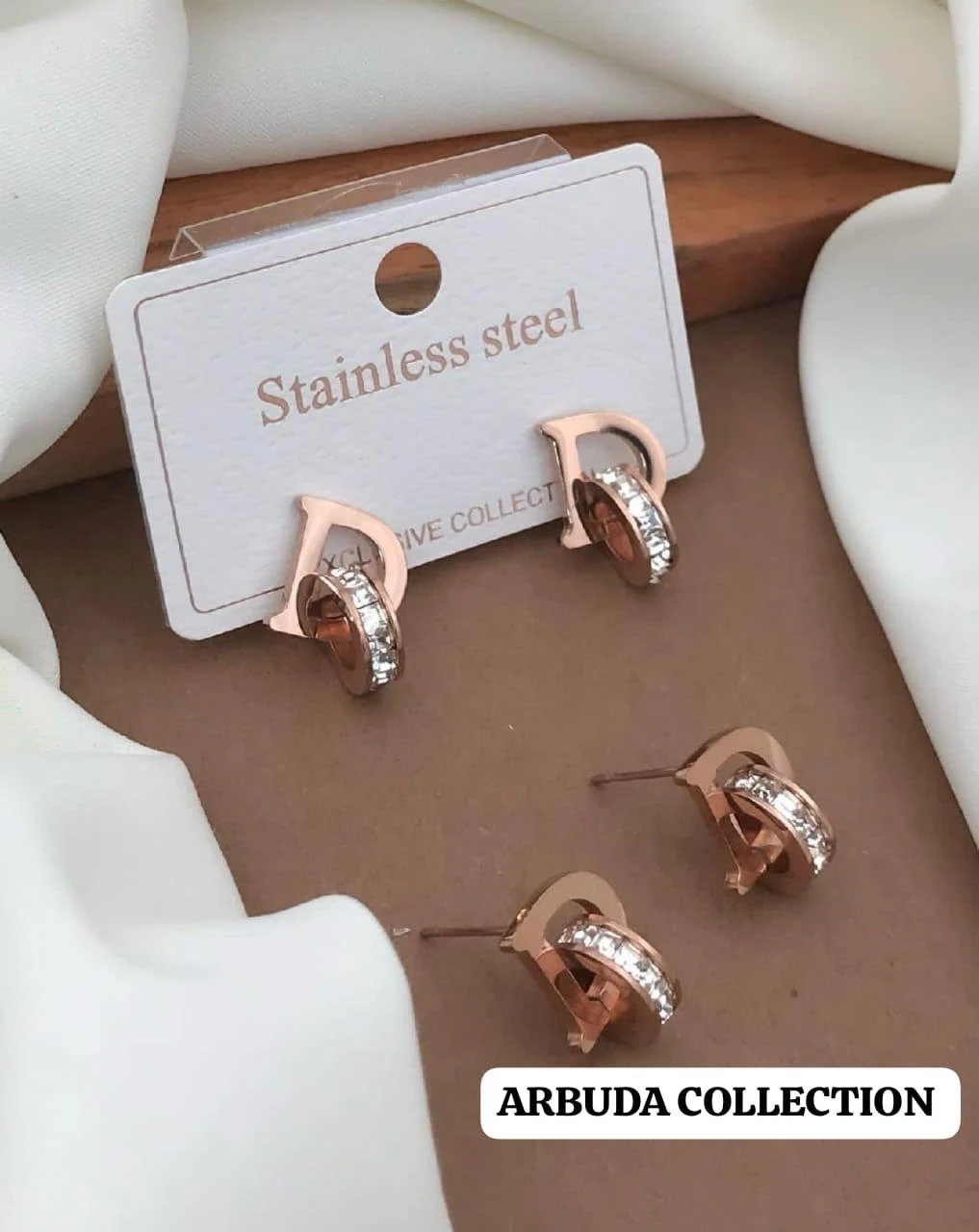 stainless steel CZ studded alphabetical letter "D" stud earrings.