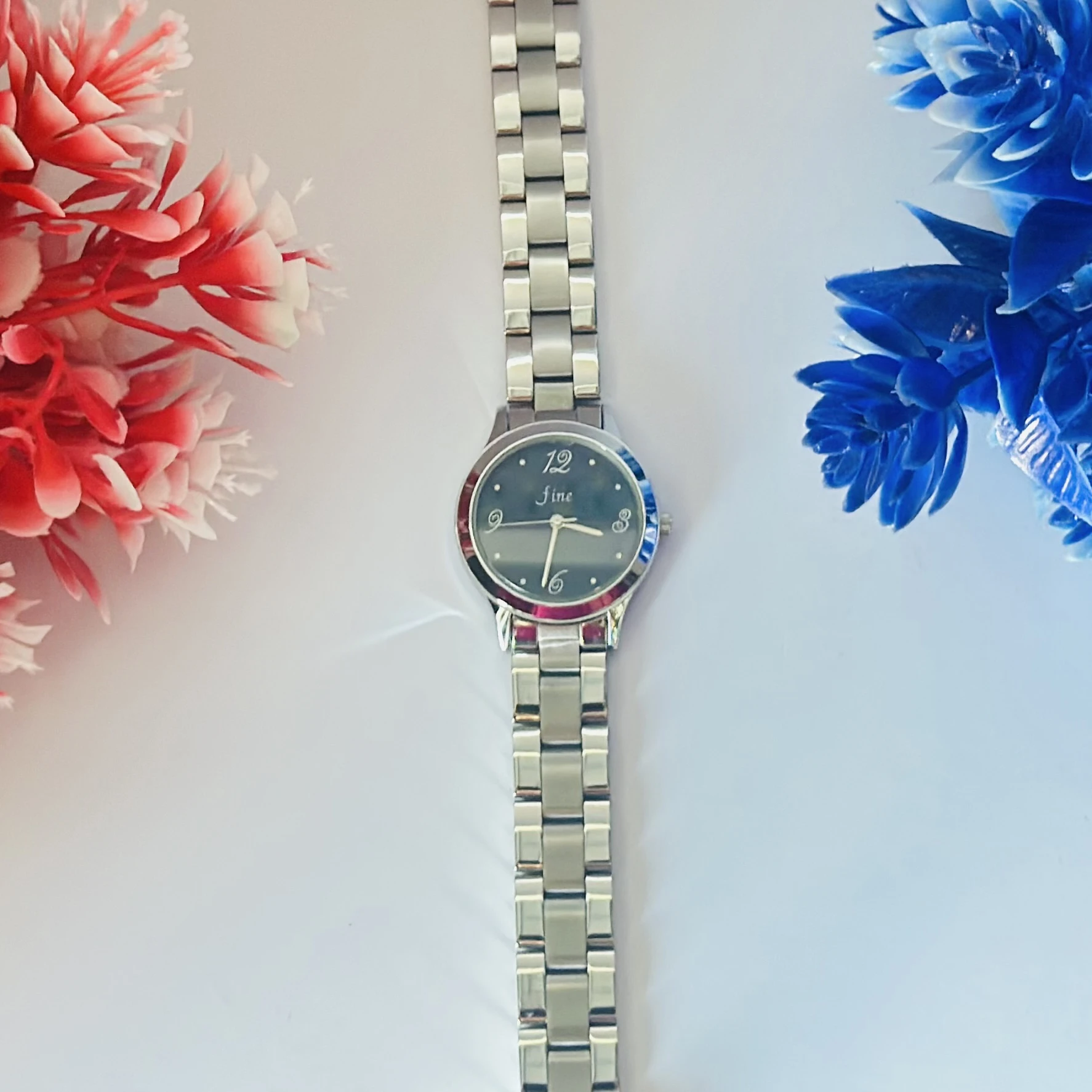 Bracelet watch with a silver-tone stainless steel
