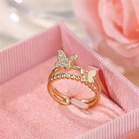 Rose gold plated cubic zirconia butterfly double band ring.