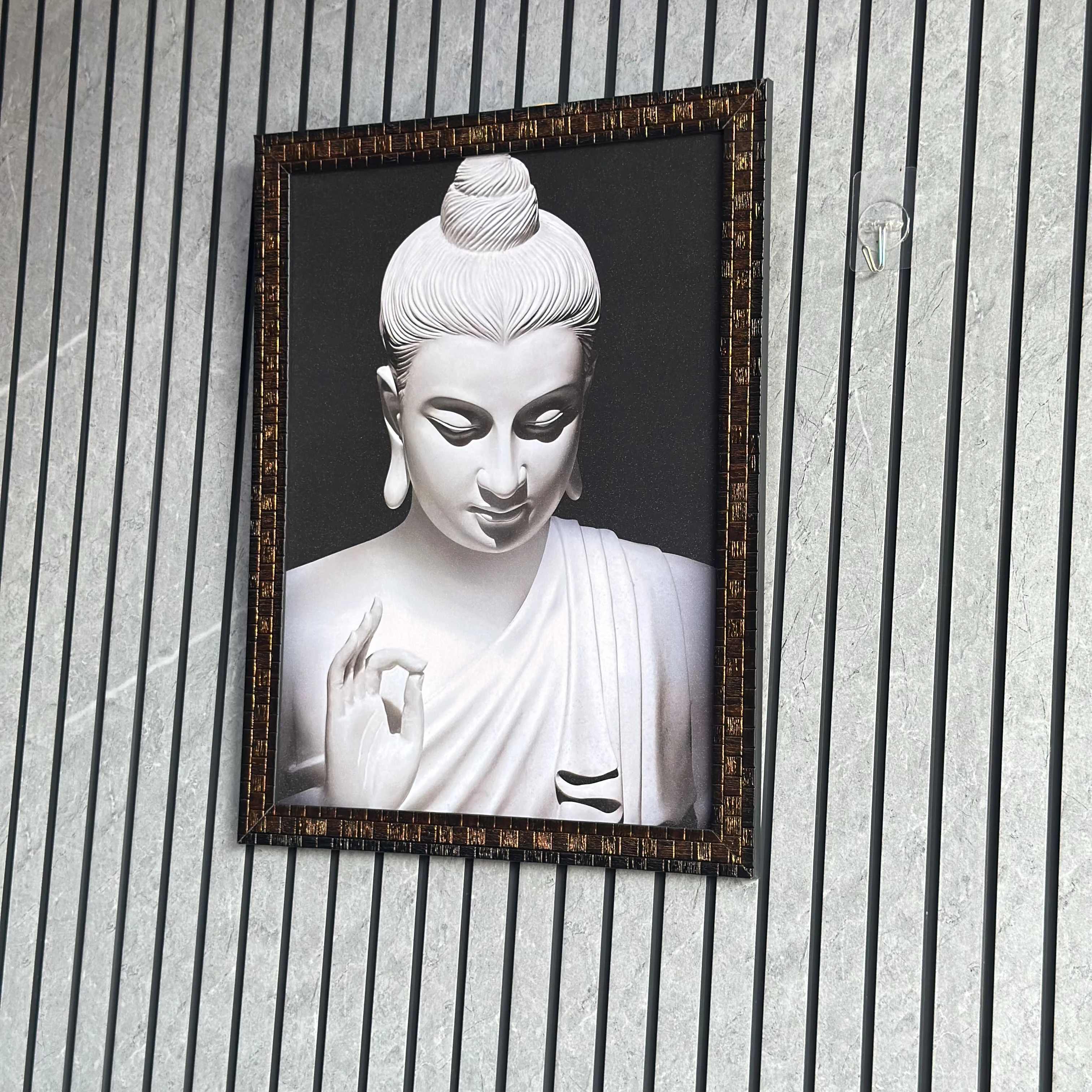Wall art depicting a statue of Buddha. (SKU-AMKNZY)