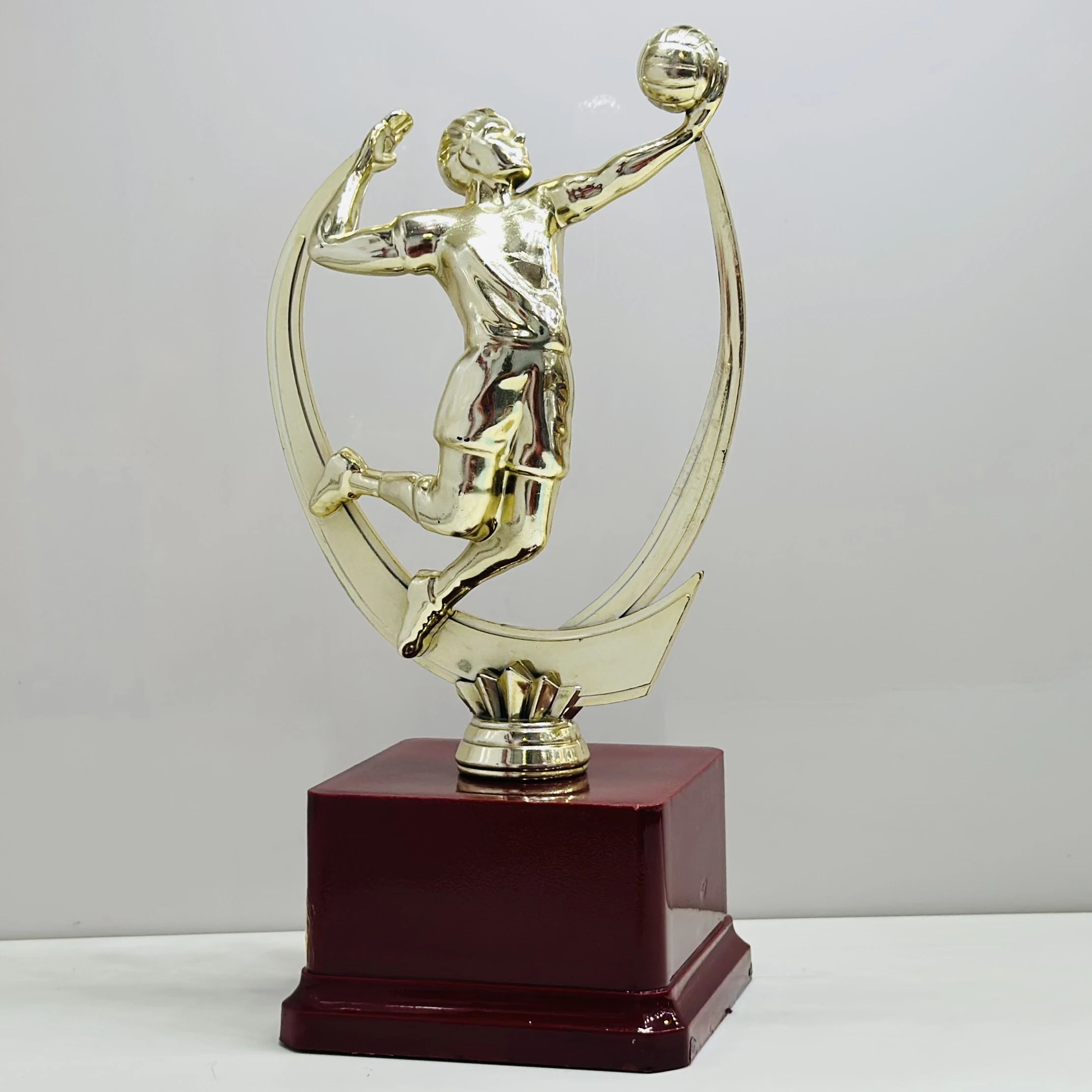 cricket trophy featuring a batsman figure.
