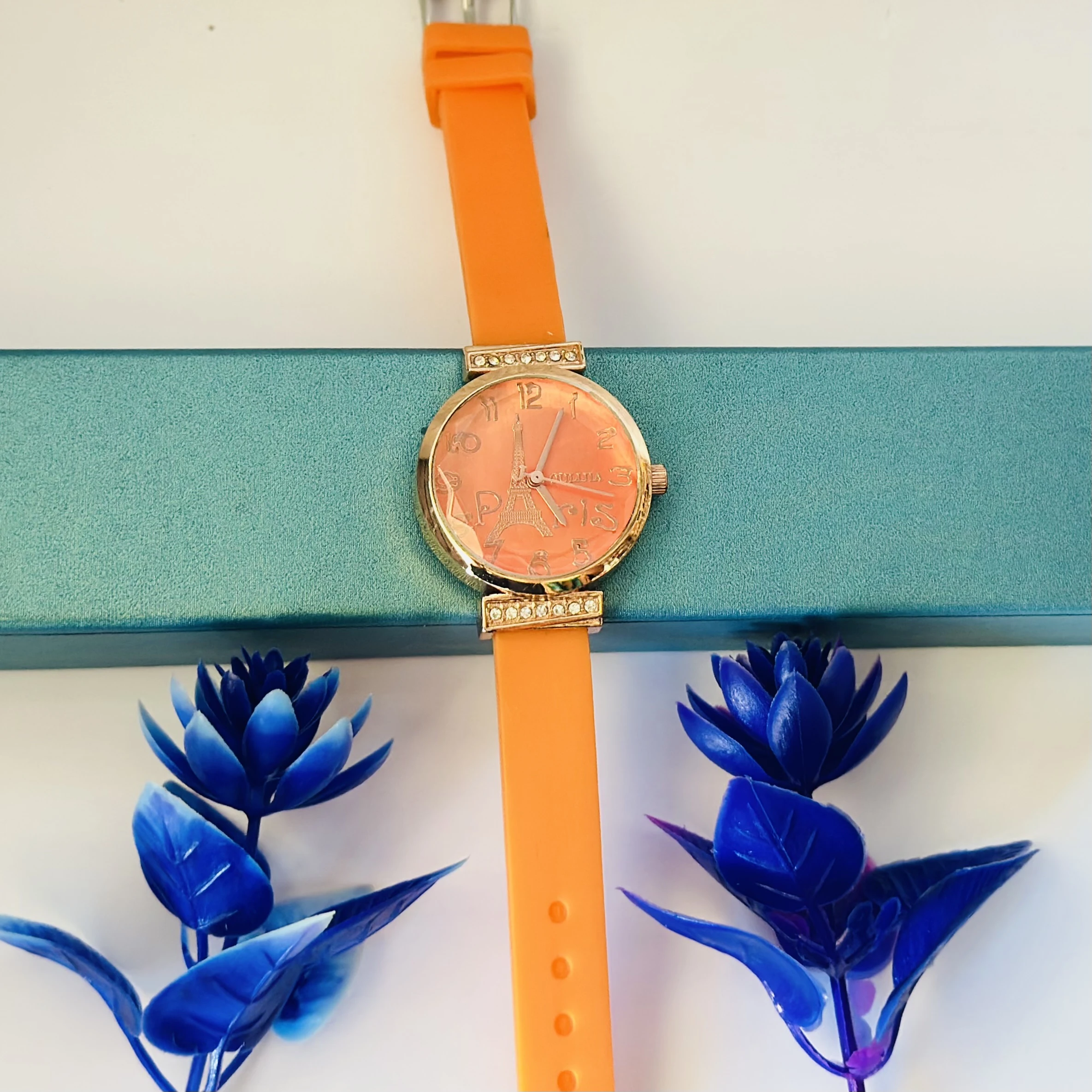 Women's Metal Analog Watch with an orange silicone strap