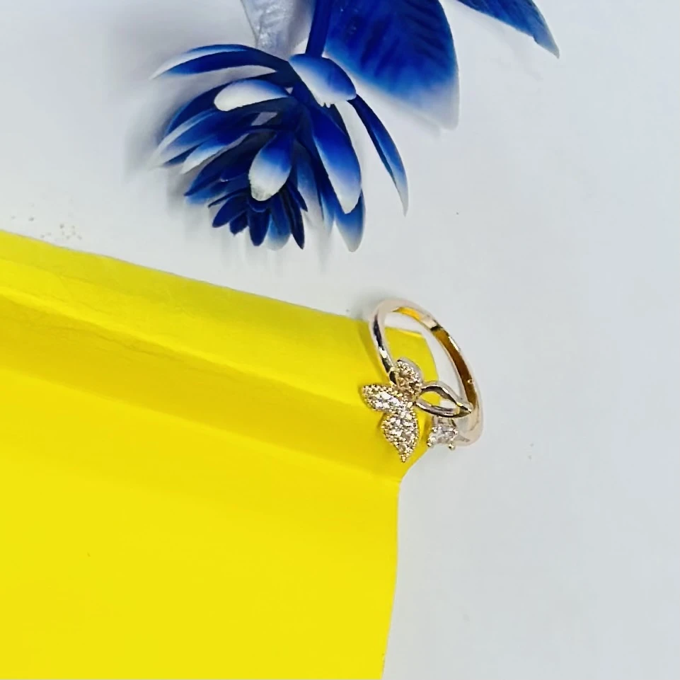 An adjustable rose gold-plated butterfly ring
