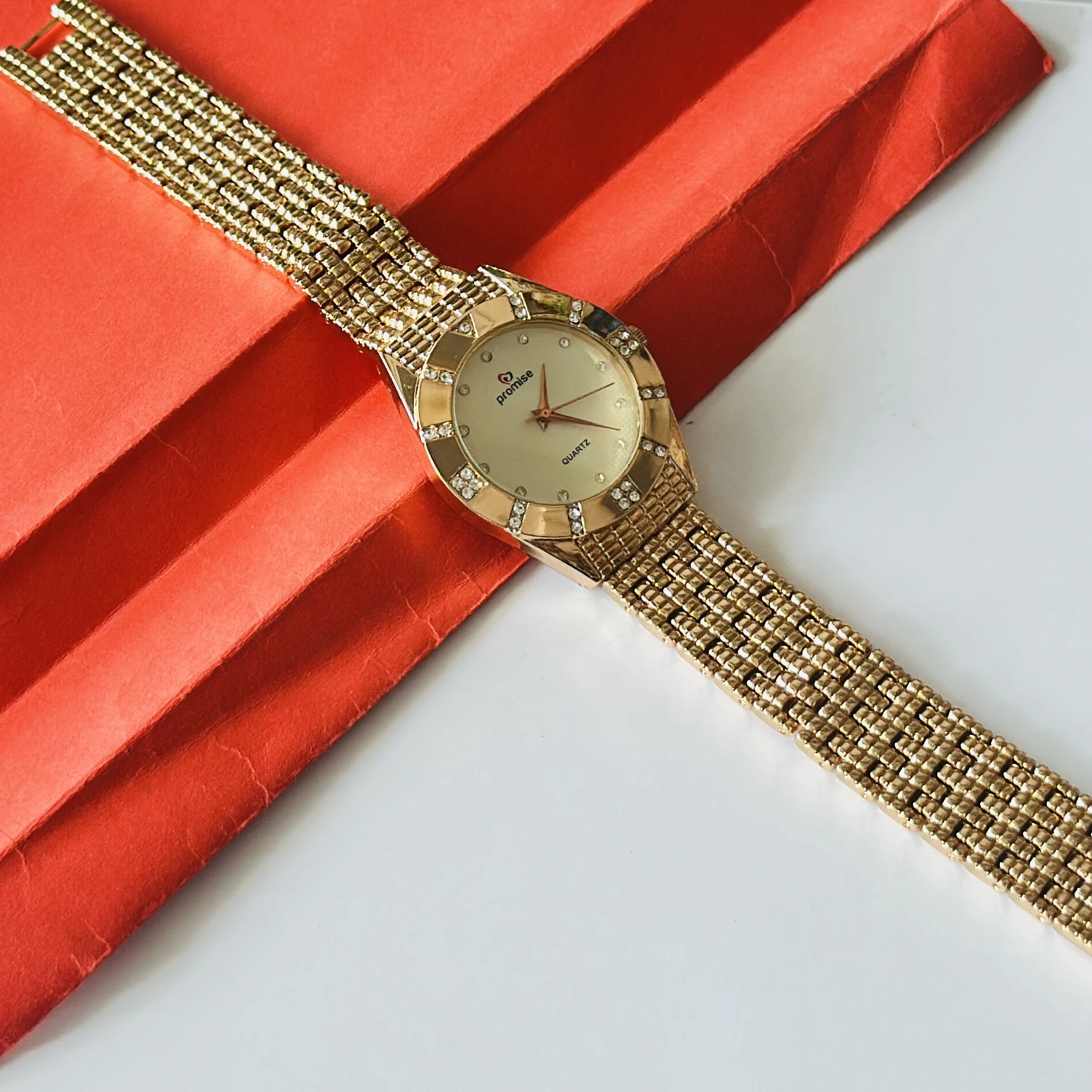 gold-toned Promise brand quartz women's watch