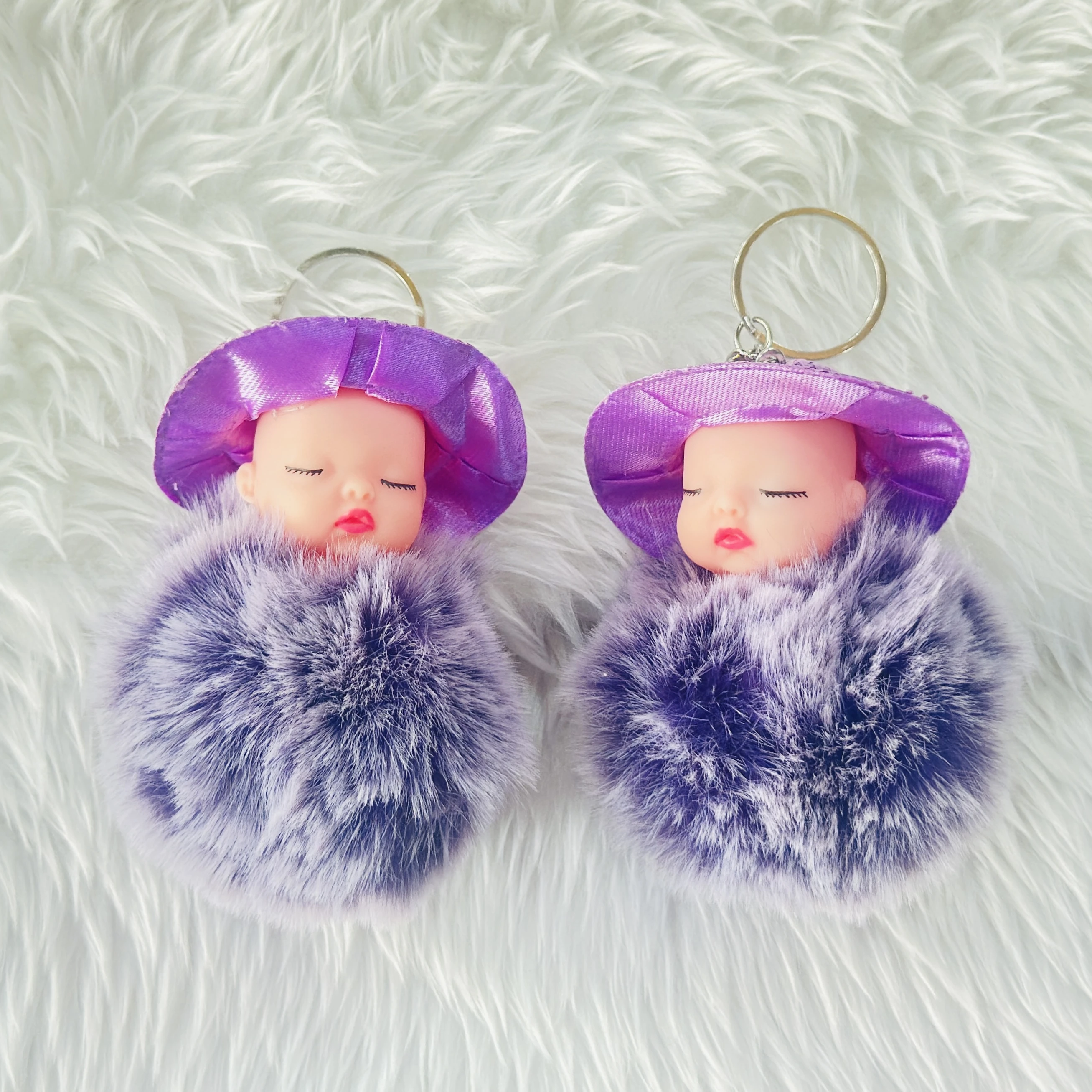 sleeping baby doll fluffy pom pom keychain